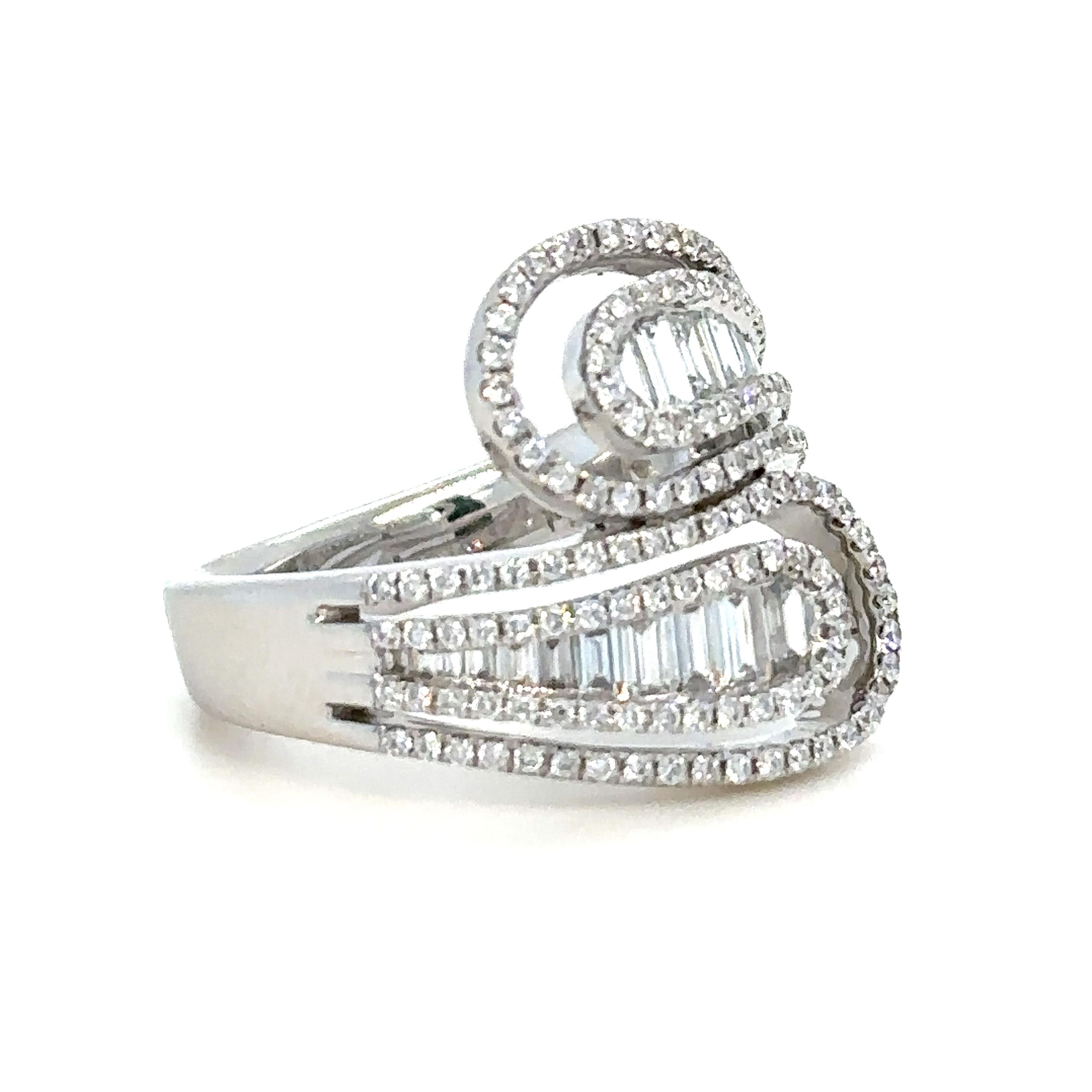 Unique features:

Diamond dress ring. Made of 18ct White Gold, and weighing 8.5 gm. Stamped: 750. Set with 144 round, brilliant cut Diamonds, colour F and clarity VS-SI.

And 21 baguette, step cut Diamonds, colour F and clarity VS-SI. with a total