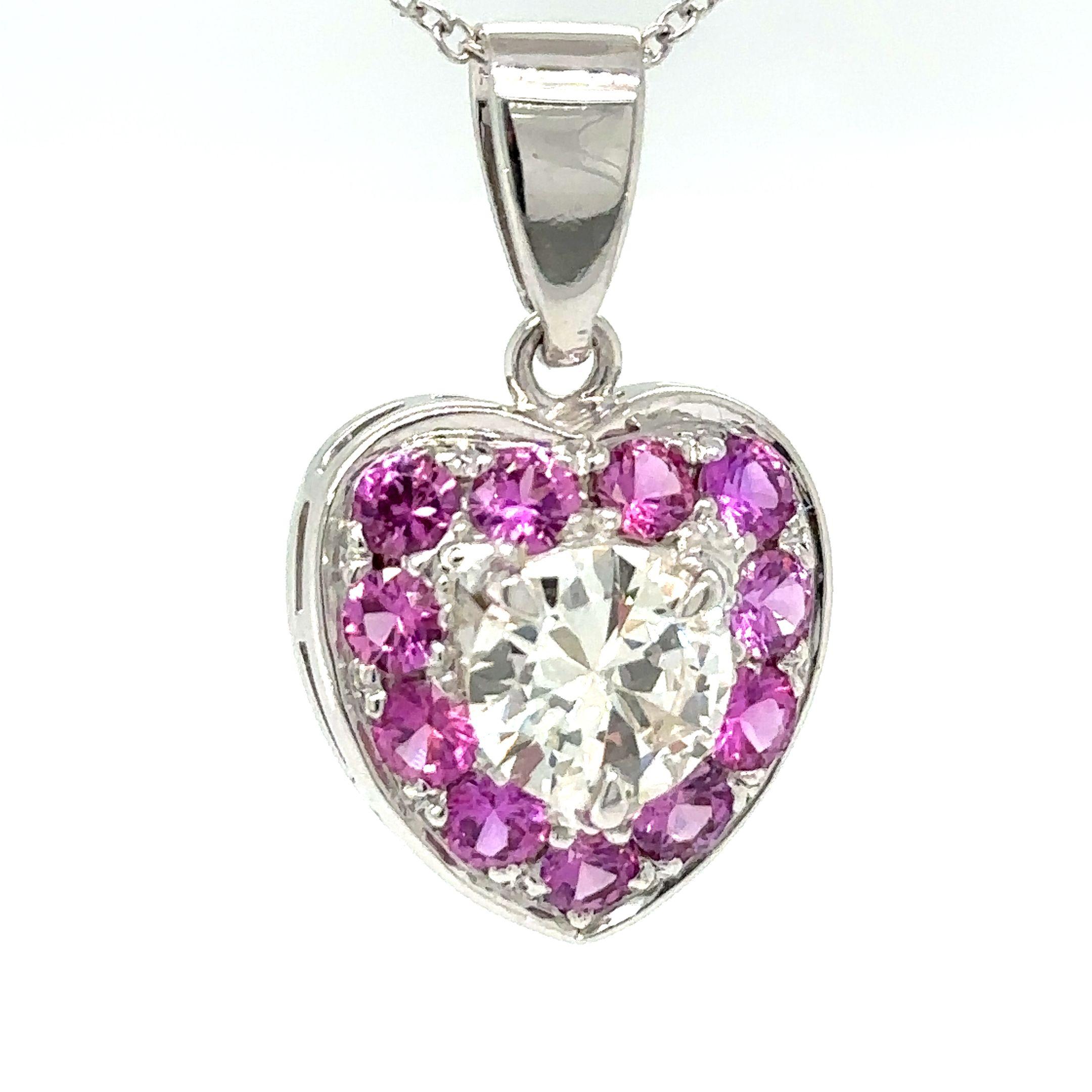 Unique features: 

A Bespoke Diamond Heart Pendant, made of 9ct White Gold. Heart shaped cluster pendant set to the centre of the railed mount in three tapered claws with one round brilliant cut diamond, I-J colour, SI1 clarity with a weight of