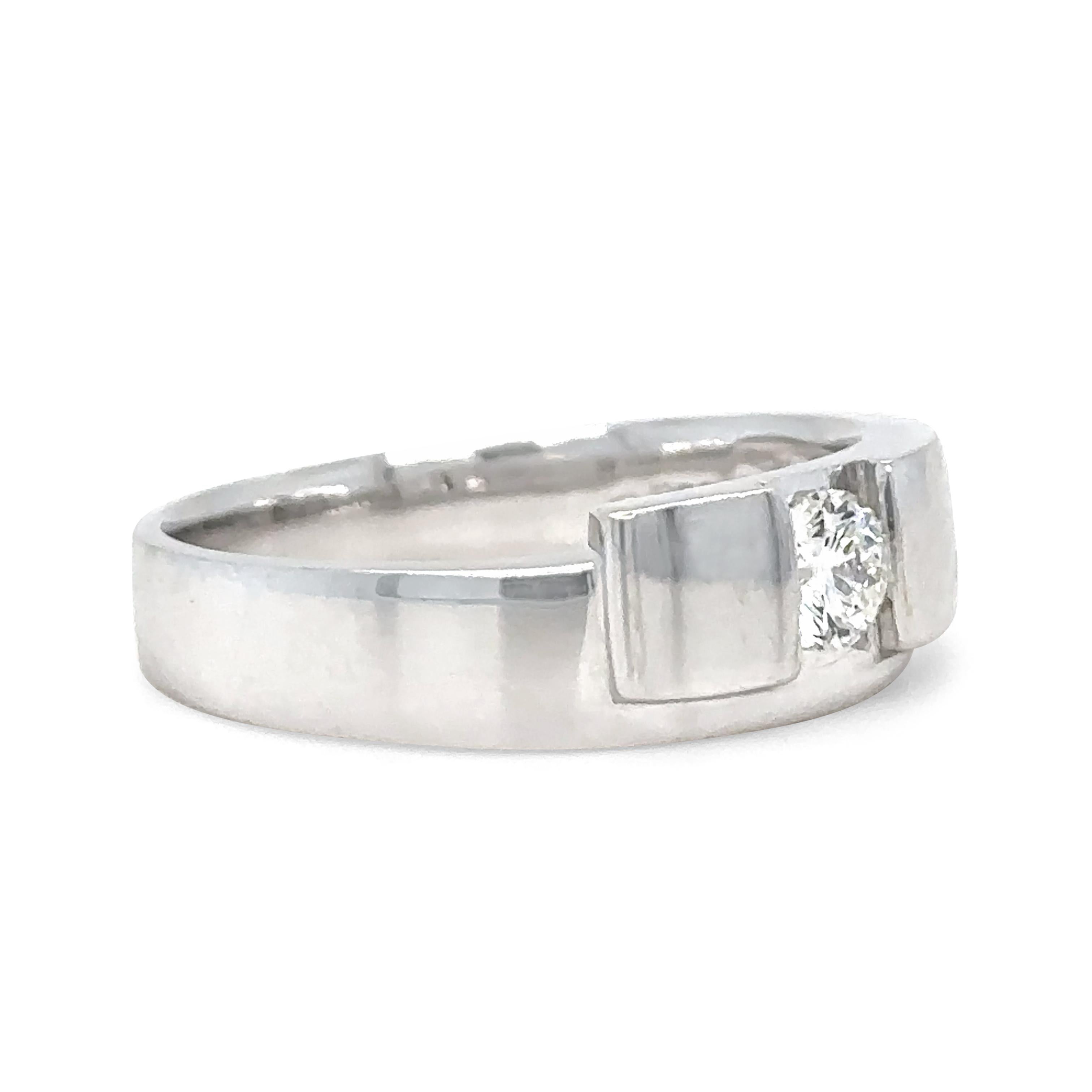 A Bespoke Solitaire Round Brilliant Cut Diamond Ring, half bezel set in 18ct white gold on a 6.6 to 3.5mm tapered band.

Diamond 0.30ct (actual weight), Graded in setting as Colour: G, Clarity: SI1.  Very good cut.

Metal: 18ct White Gold
Carat: