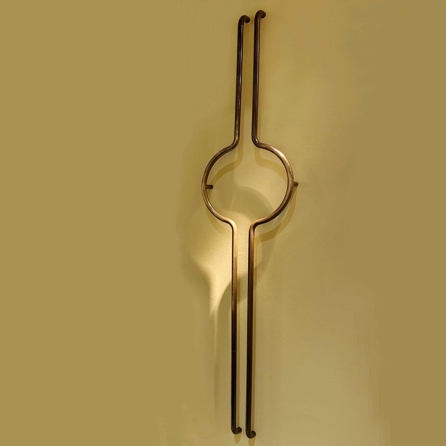 Two pairs of elongated push & pull tubular bronze door handles. They are bespoke 1960s and came from double glass doors from a formal bank in Germany with glass doors.
The patina is original but they polish up shiny as well.
View all our listings of