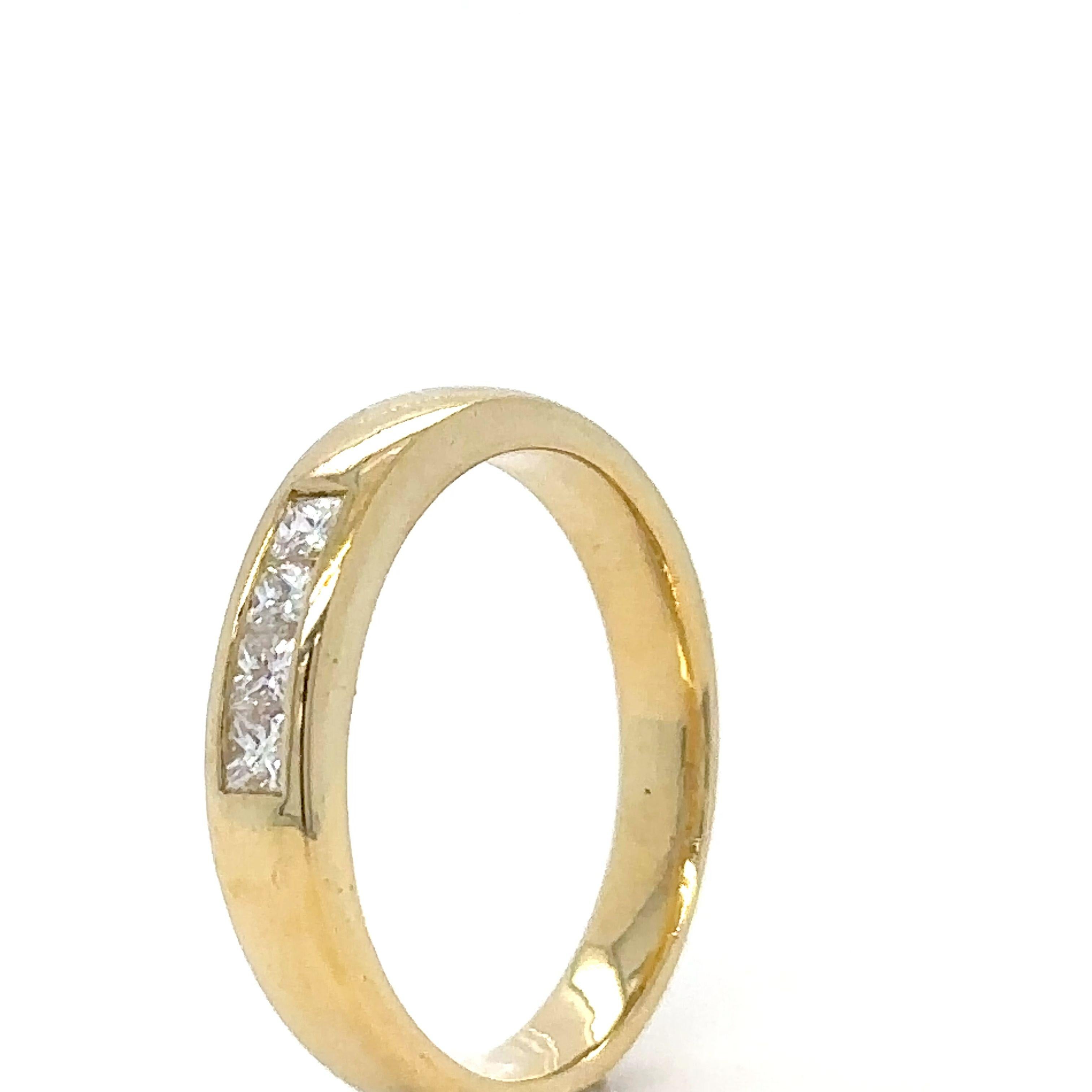 A Four Stone Princess Cut Diamond Ring, channel set in 18ct yellow gold on a 3.7 to 3.1mm tapered band.

Diamonds 4 = 0.24ct (estimated),

Graded in setting as Colour: F, Clarity: VS. Weight 4.66 grams.
Metal: 18ct Yellow Gold
Carat: 0.24ct
Colour: