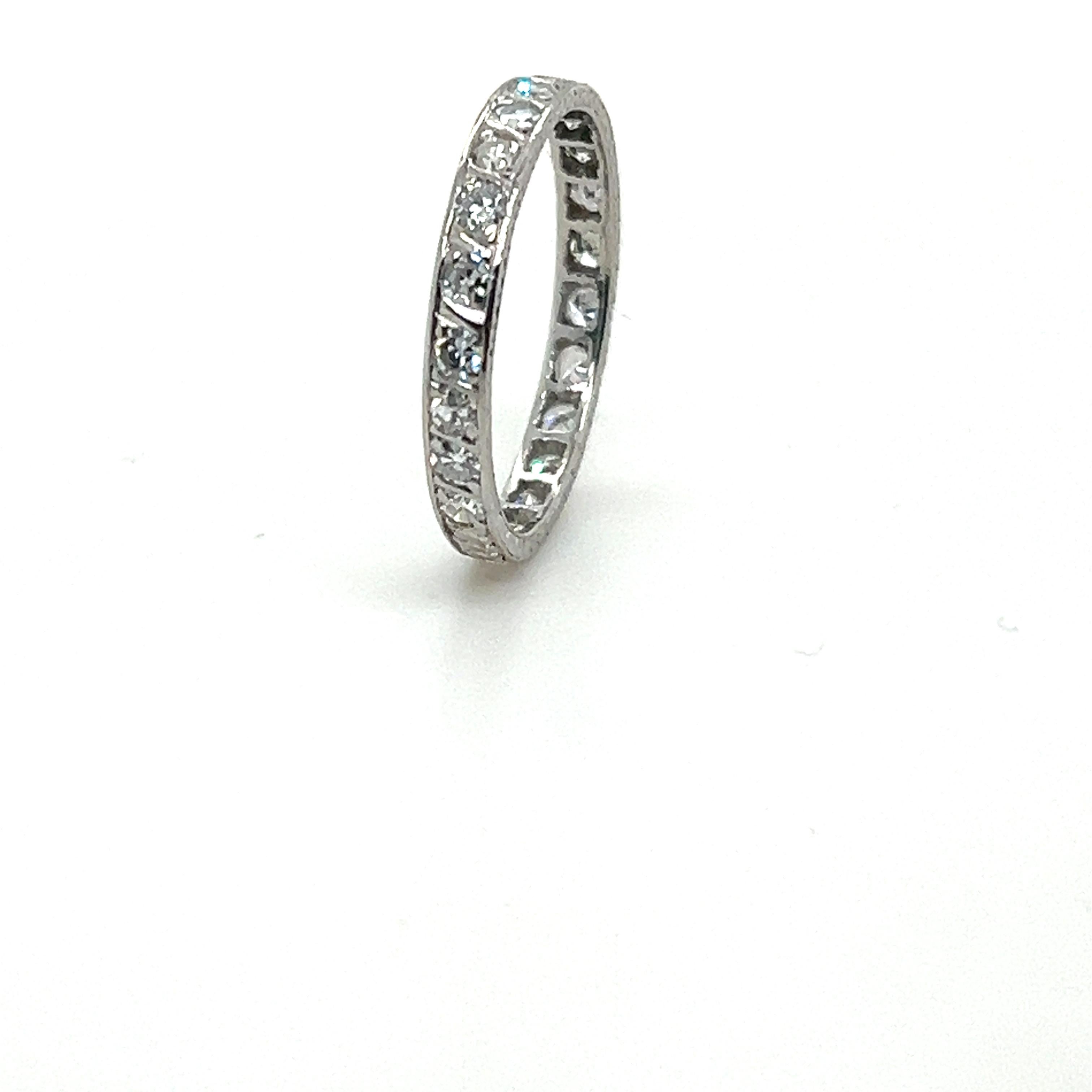 A Diamond Full Circle Wedding Ring, with 22 single cut diamonds bead set in platinum with hand-engraved sides on a 3mm band.

Diamonds 22 = 0.88ct (estimated).

Circa 1950.

Metal: PT950 Platinum
Carat: 0.88ct 
Colour: N/A
Clarity: N/A
Cut: Single