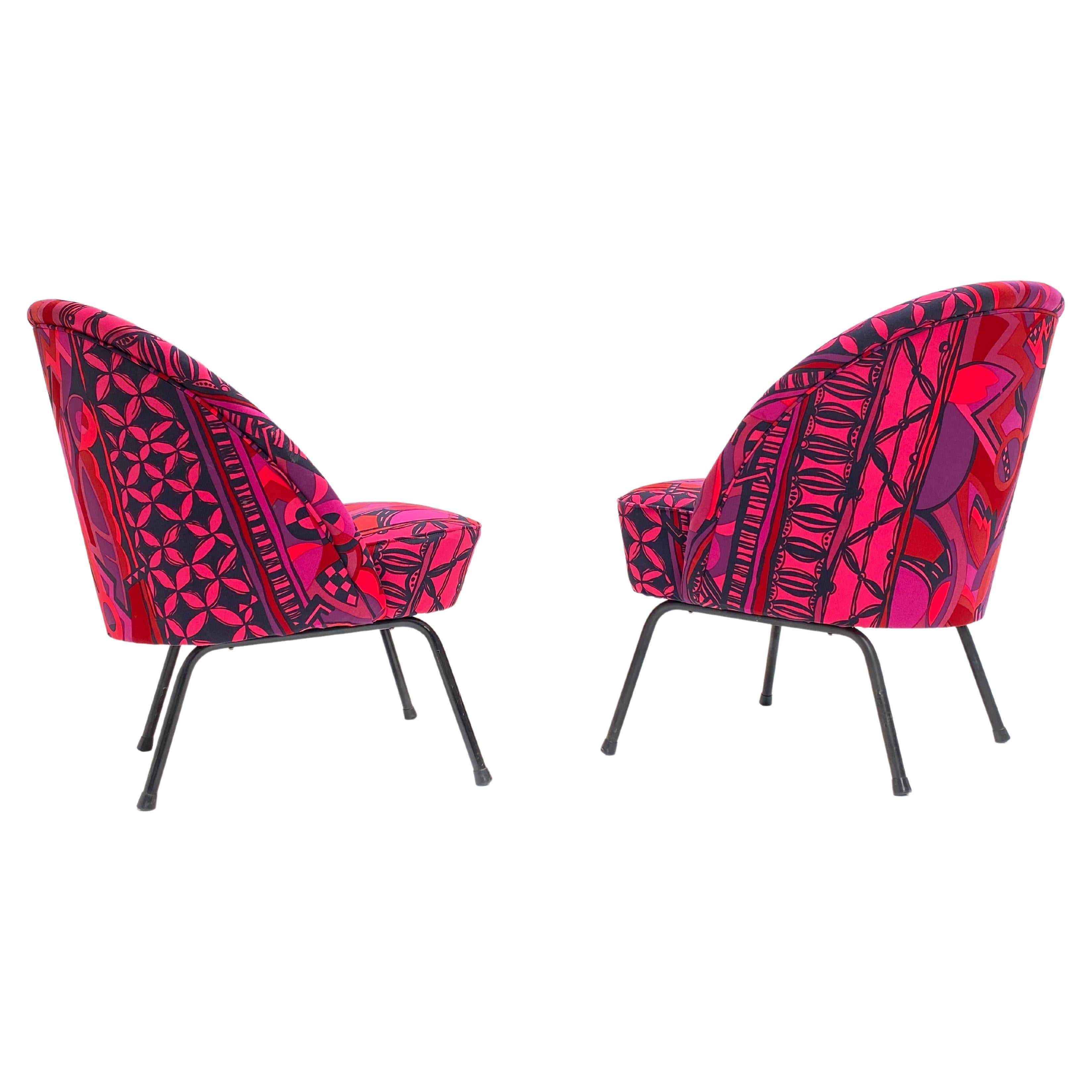 This pair of 1950's 'cocktail' chairs has been custom upholstered with exclusive and bespoke old stock fabric by Gianni Versace

A unique pair of side chairs with the flamboyant appeal of Gianni Versace.

