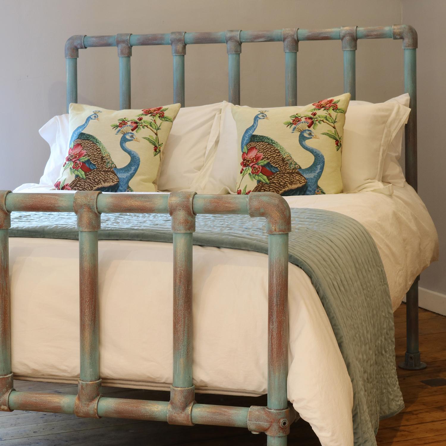 A bespoke made-to-measure iron bed made from recycled scaffolding fittings and tube. This particular piece has been hand painted in our blue verdigris but you can have your own choice of colour when ordering. Either select from our range of colours