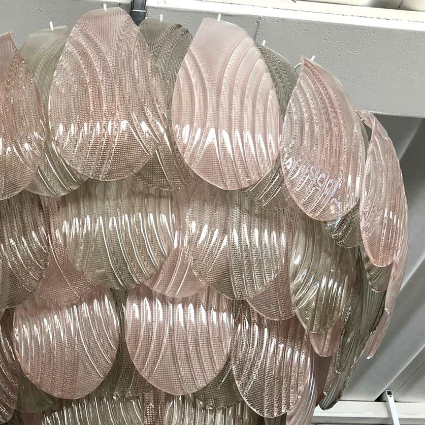 Contemporary Art Deco style ballroom chandelier, in sophisticated rose pink and smoked green colors. The organic design of this impressive nature inspired light fixture consists of overlapping textured Murano glass leaves, each individually blown