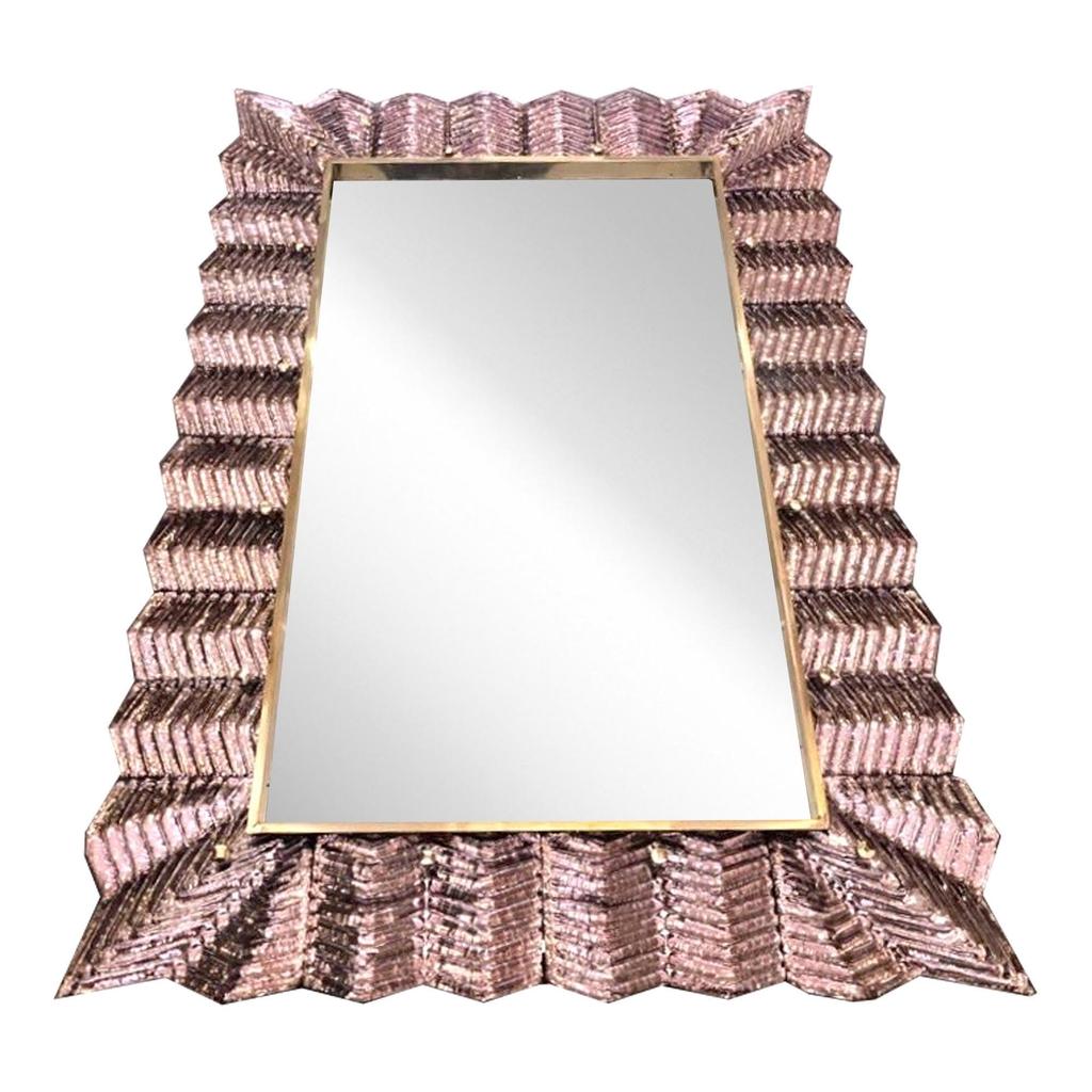 Venetian contemporary Couture design rectangular wall mirror, custom made in Italy, framed with a thick border in high quality blown Murano art glass in blush rose color, artistically decorated with a typical Art Deco reeded sculpture pattern that