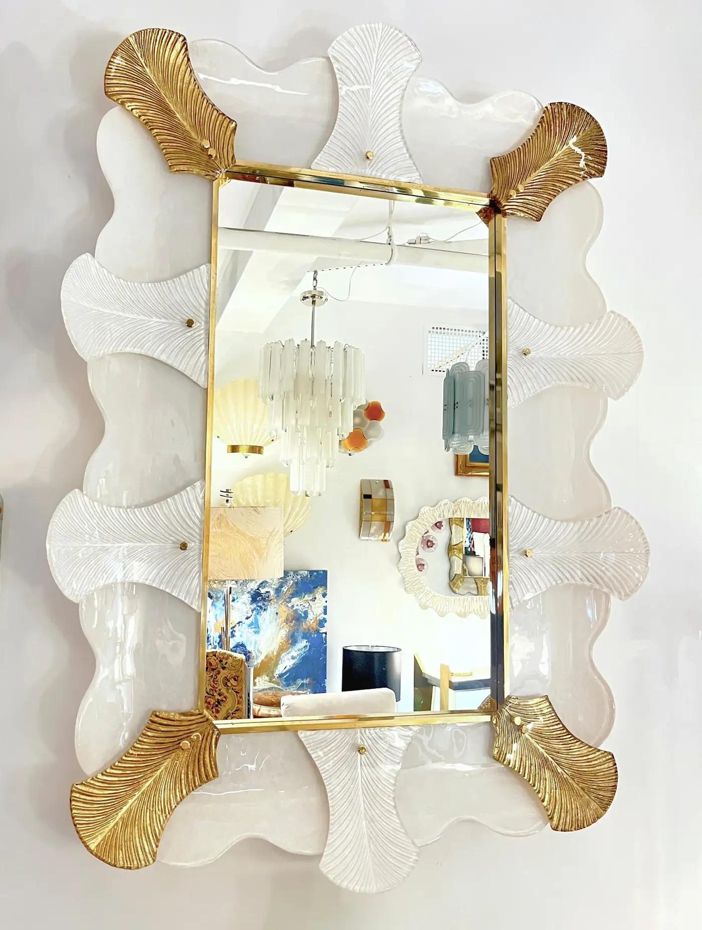 Venetian contemporary Couture design rectangular wall mirror, custom made in Italy, framed with a thick border in Art Deco Design, composed of high quality blown Murano art glass textured leaves, the 4 corners worked with 24-karat gold leaf, fitted