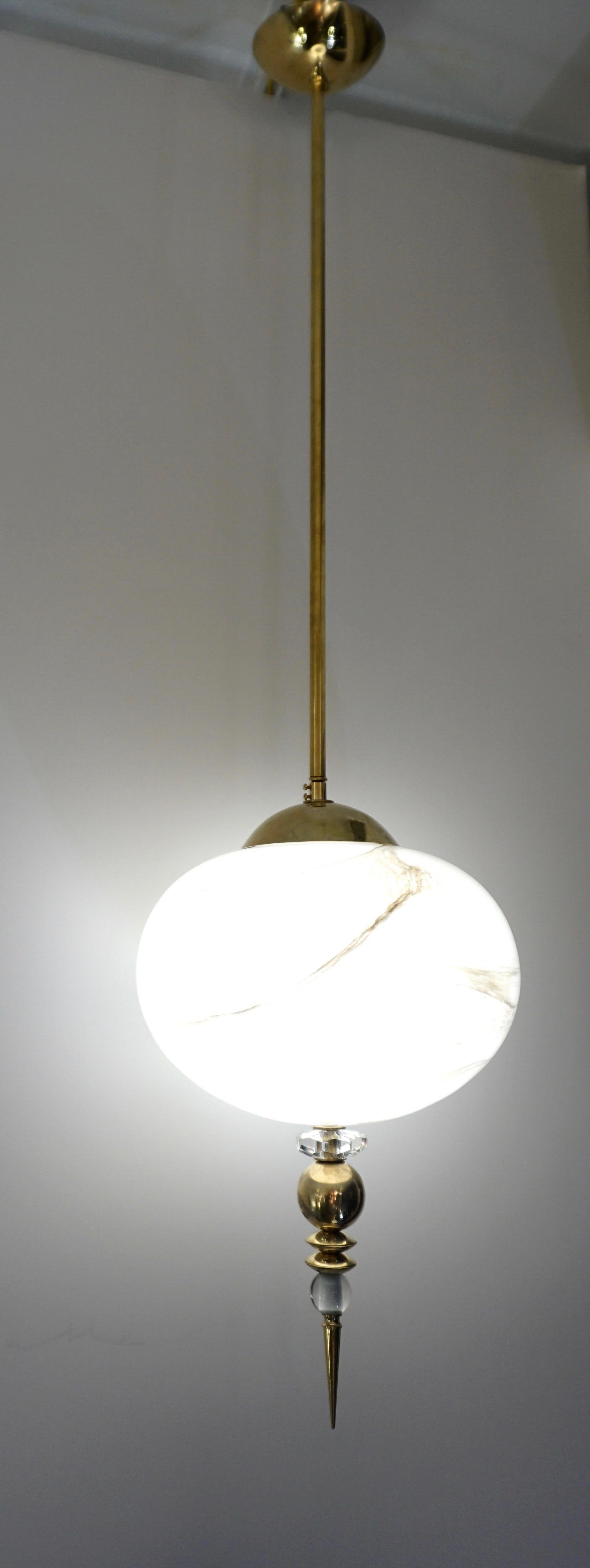 A contemporary custom egg shape pendant chandelier of a modern geometric series, entirely handcrafted in Italy, the organic oval globe in an innovative blown Murano glass to resemble alabaster with the benefit to be lighter and to remain over time