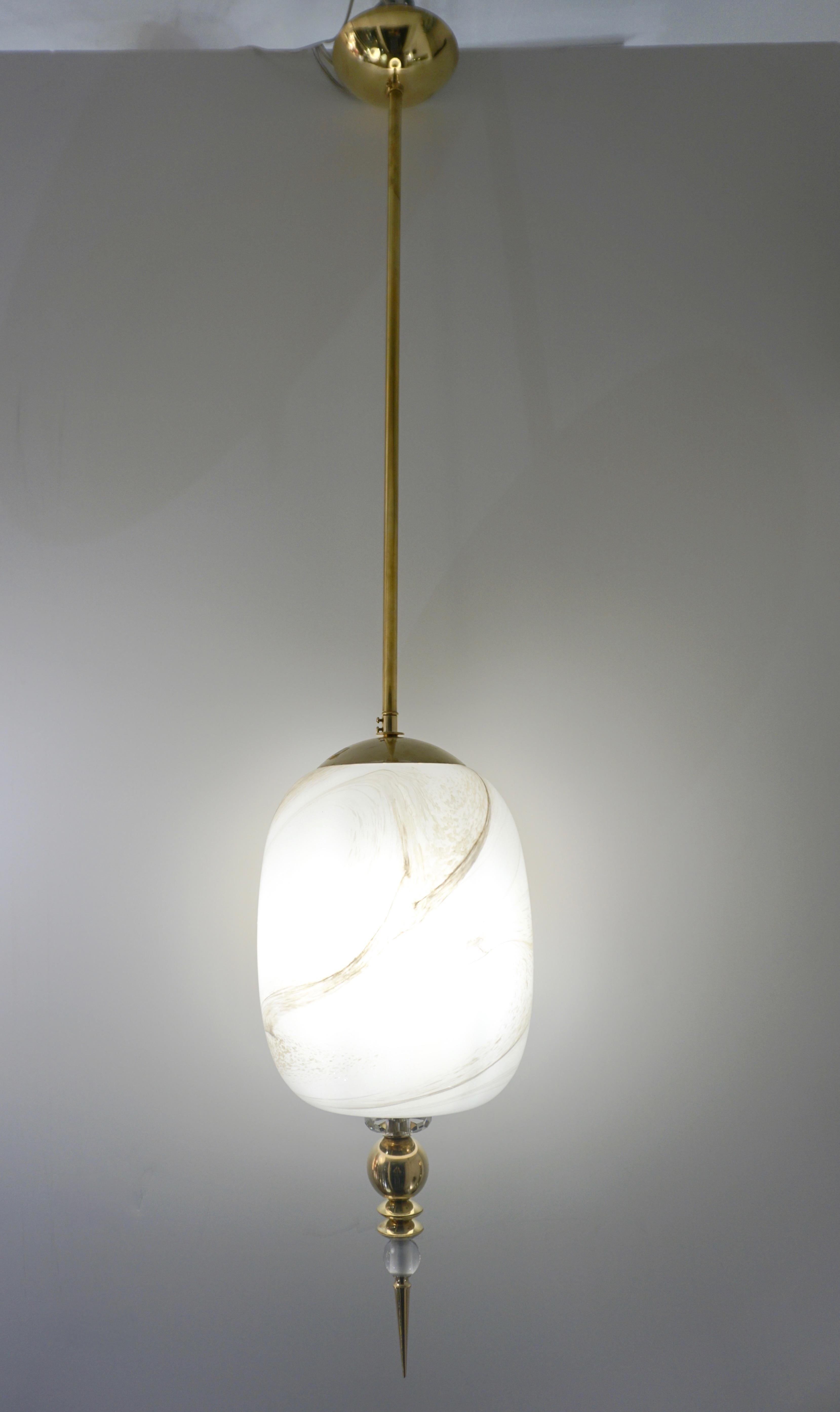 A contemporary custom jar lantern/pendant chandelier of a modern geometric series, entirely handcrafted in Italy, the organic cylindrical body in an innovative blown Murano glass to resemble alabaster with the benefit to be lighter and to remain