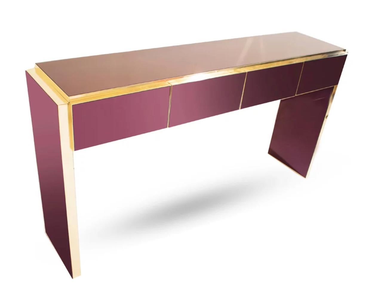 Contemporary Bespoke customizable 4-drawer modern console / sideboard, entirely handcrafted in Italy, with a minimalist Art Deco Design, the dramatic surround decorated with art glass in a striking unusual metallic wine color with a back note of