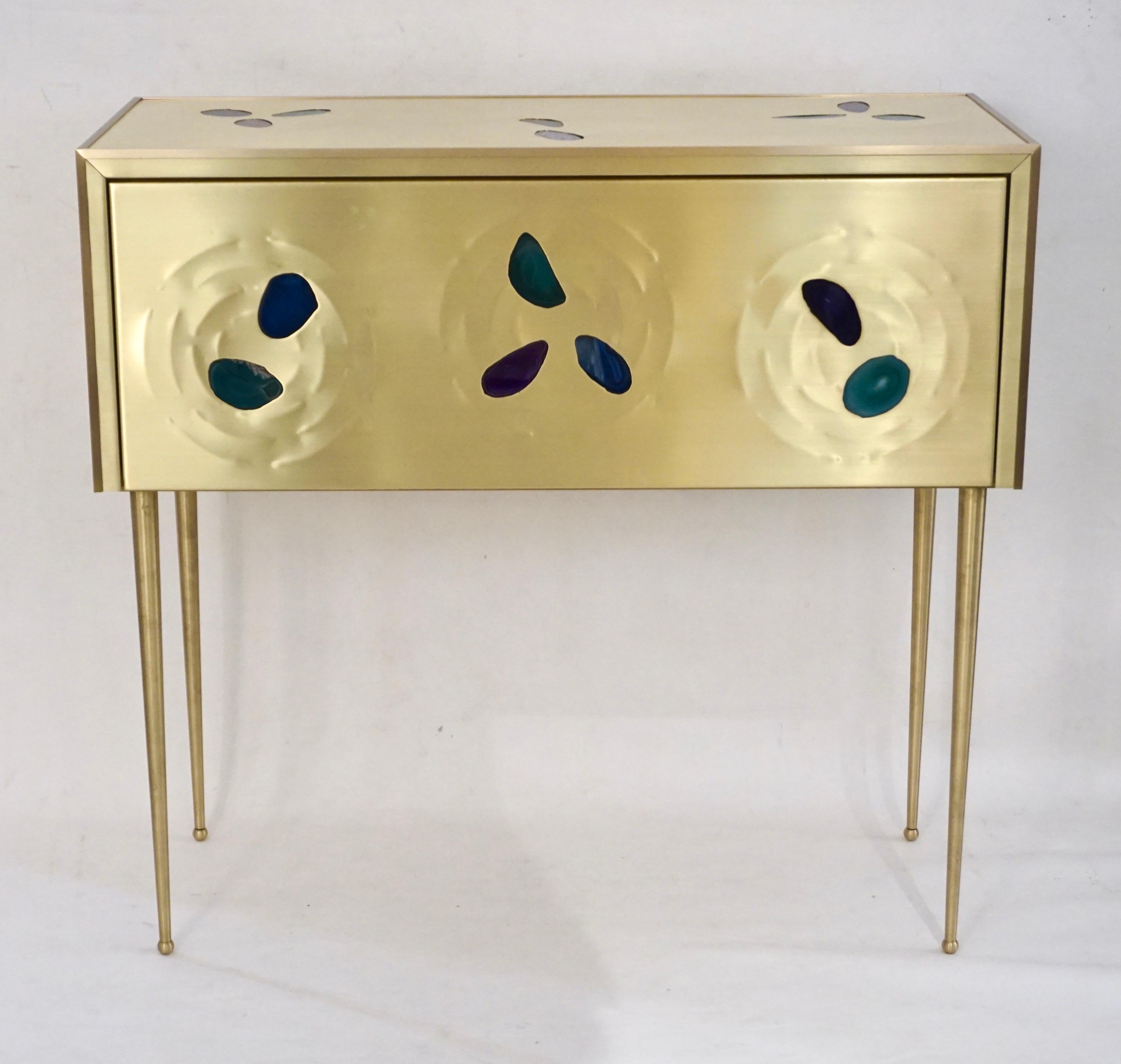Contemporary modern Italian Fine design console / side table with 1 soft closure drawer, entirely hadn't made and wrapped, the back as well, in gold brass decorated with organic insets of cut agate in purple, blue and green. The stone is set like