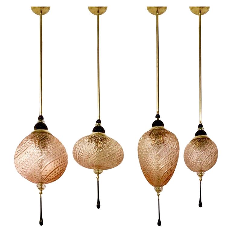 Contemporary orientalist style custom lantern chandelier, of a modern Venetian geometric series with 4 shapes as per images, entirely custom made in Italy, here with brass hardware, the organic horizontal oval shape globe in an innovative blown