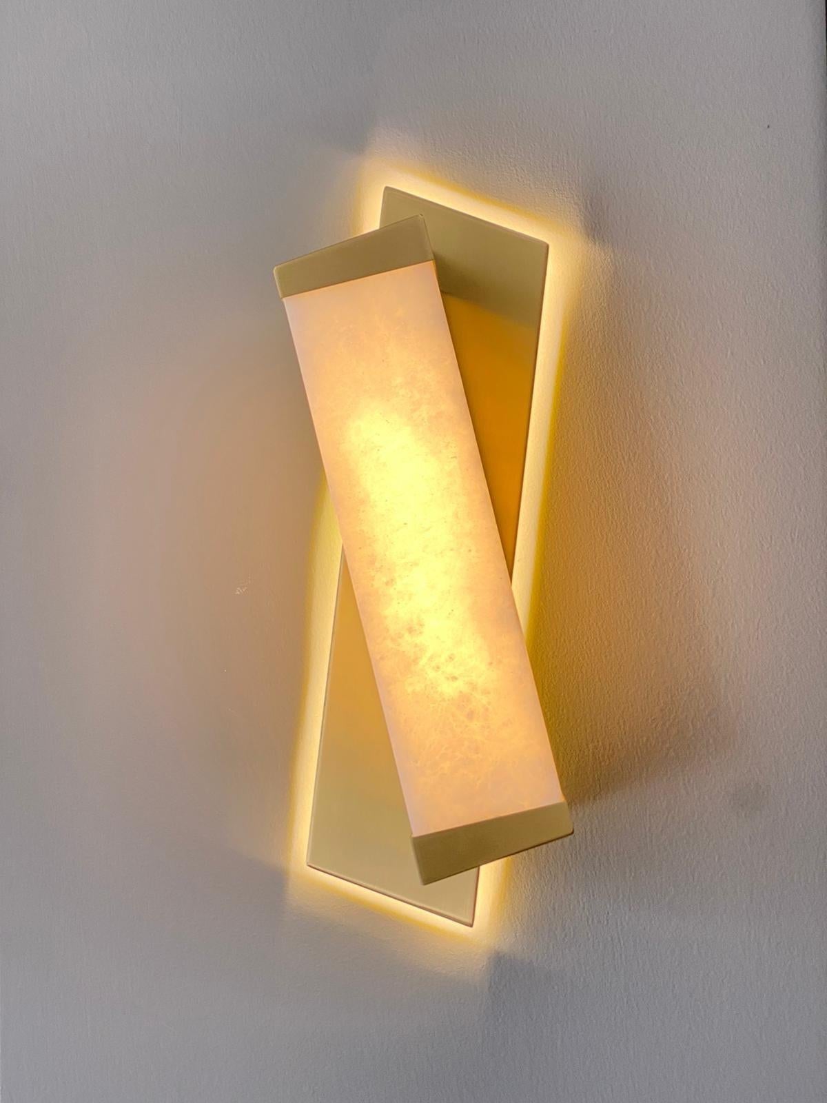 Cosulich interiors and antiques in collaboration with Matlight - Milan: this modern organic wall light, with its clean and simple geometric lines, has a very contemporary Minimalist flavor that is in strong contrast with the traditional materials