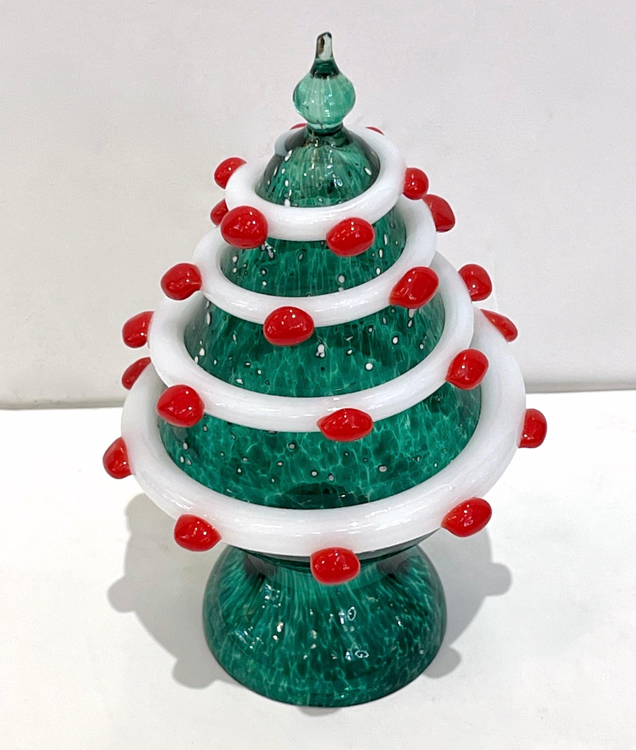 An exquisite Murano glass tree sculpture of organic modern design, a creation labeled Galliano Ferro Murano, individually mouth-blown and handcrafted. The tree with a pinnacle in emerald green blown Murano glass is worked with a mottled technique