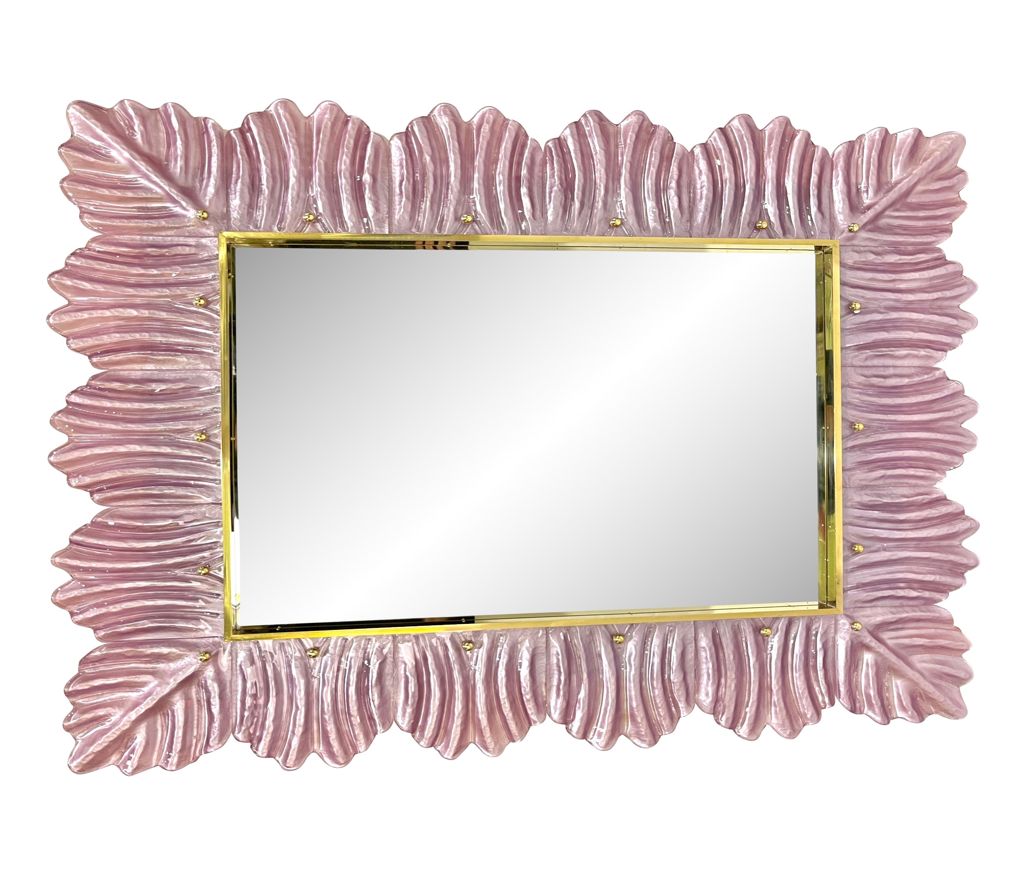 Venetian contemporary Couture design rectangular wall mirror, custom made in Italy, framed with a thick ruffle border in blown Murano art glass, with an organic reeded leaf pattern in Art Deco Design. High quality of execution and details: the pink