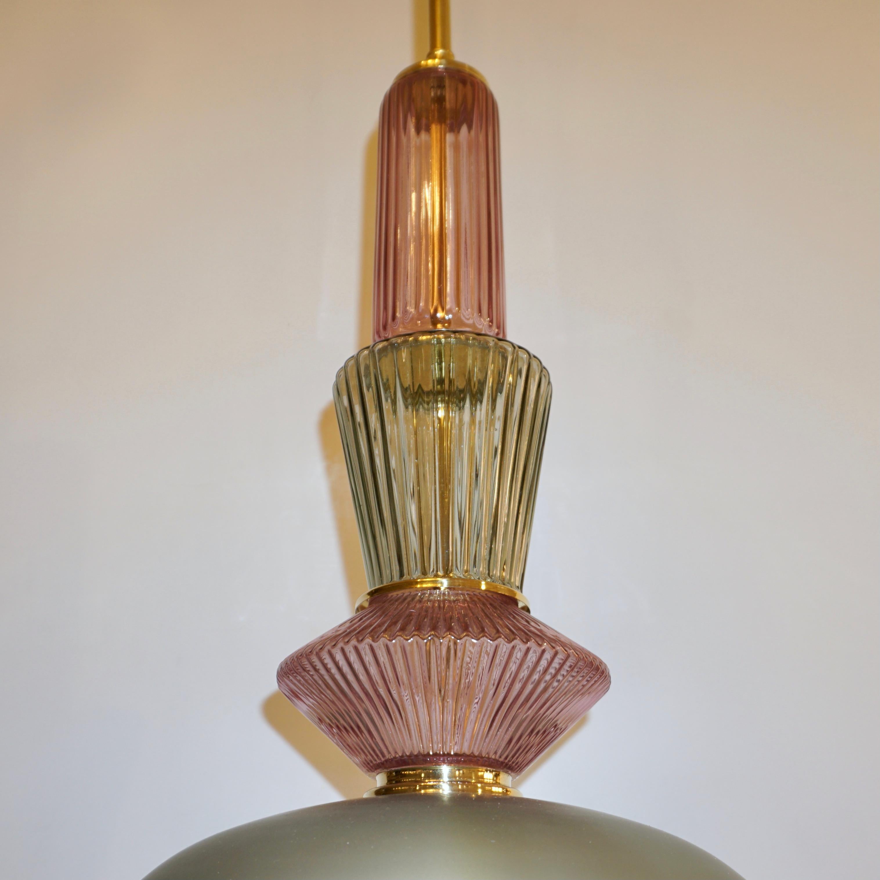 Fun and elegant Italian contemporary custom made pendant chandelier, entirely handcrafted, of organic modern design consisting of a succession of elements: handcut jewel like reeded Murano glass components in lilac lavender color and light leaf