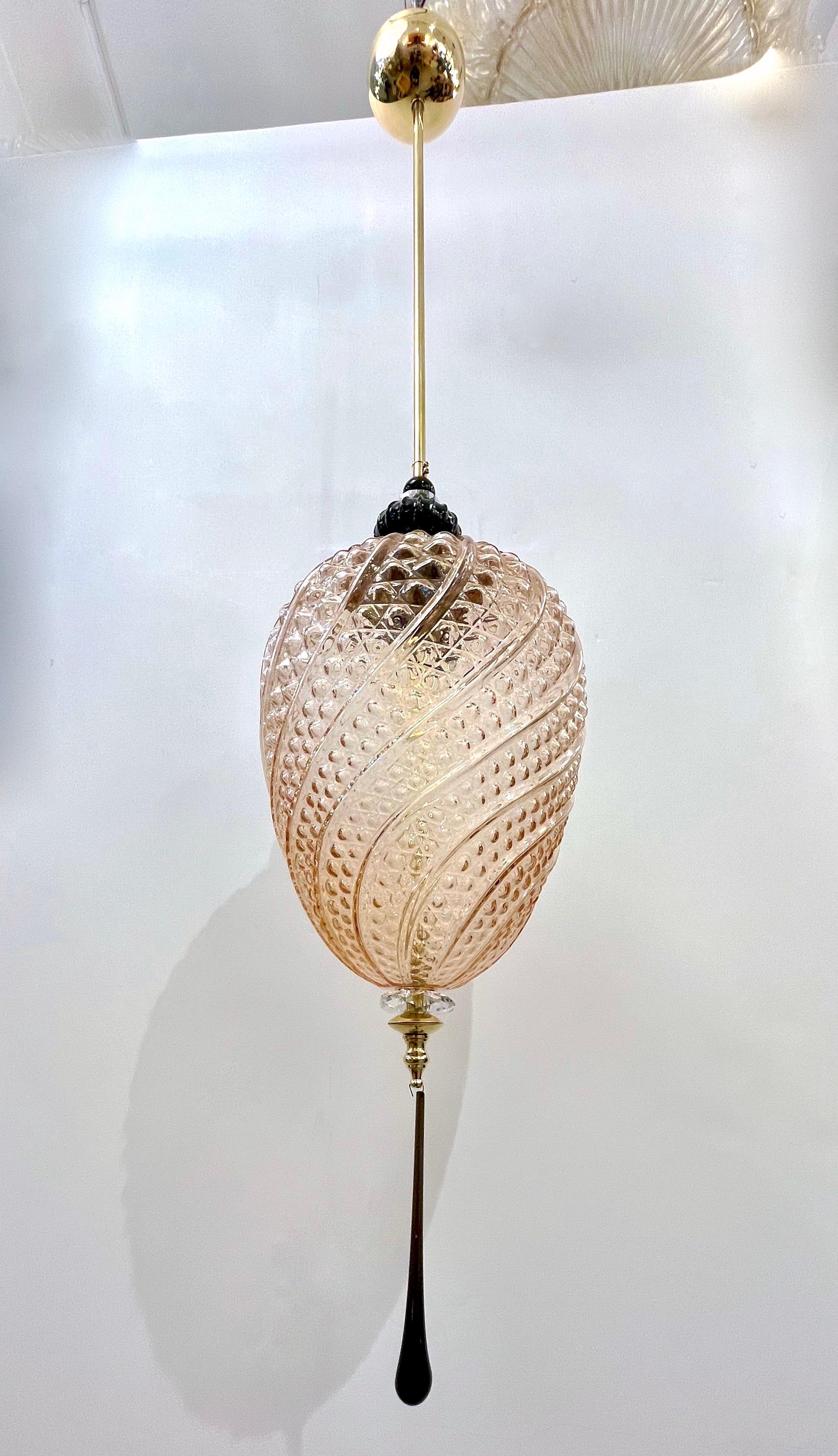 Contemporary orientalist style custom lantern chandelier, of a modern Venetian geometric series with 4 shapes as per images, entirely custom made in Italy, here with brass hardware, the organic egg shape globe in an innovative blown textured Murano