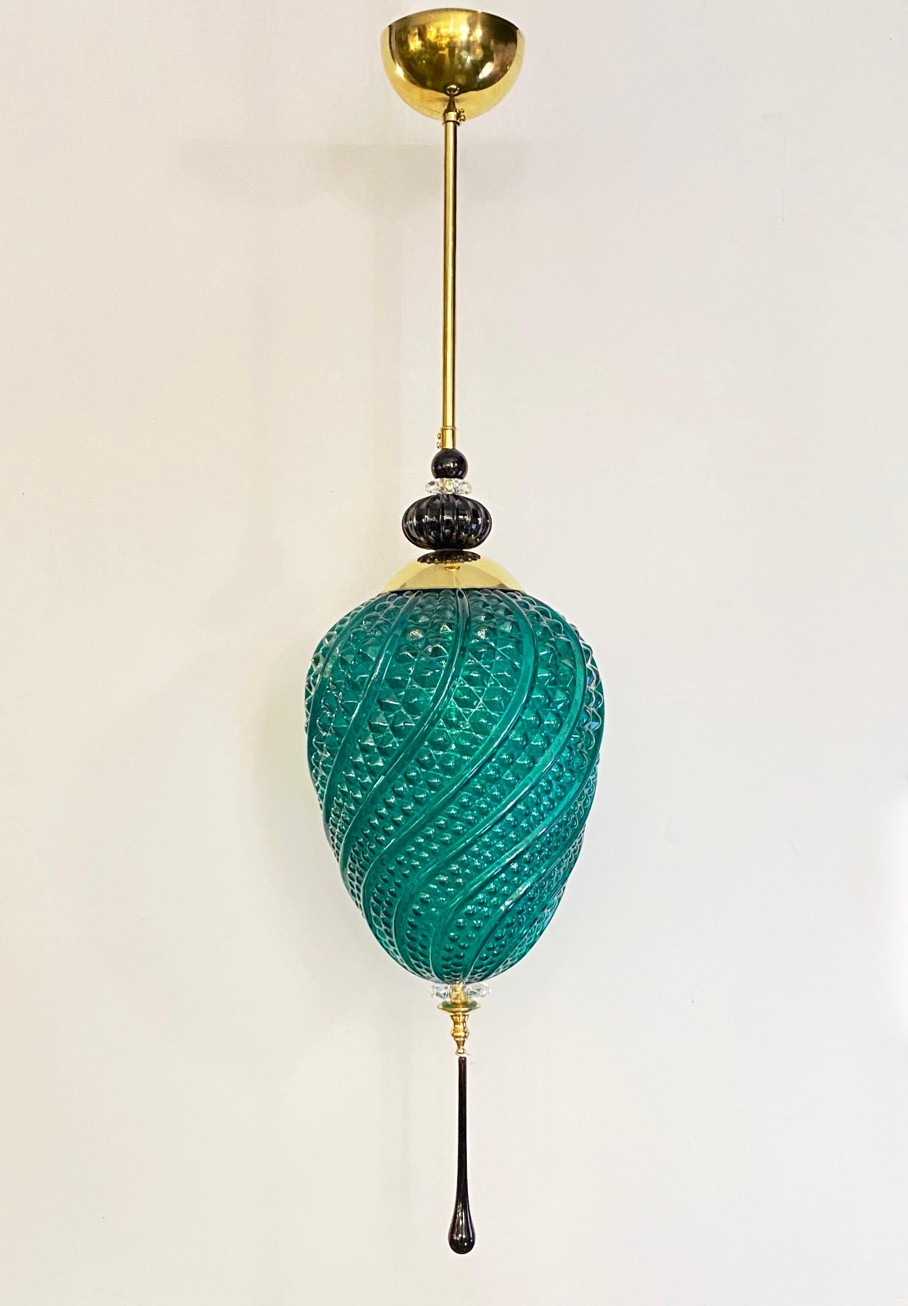 Contemporary orientalist style lantern chandelier, part of a Venetian geometric modern series with 4 shapes as per image, entirely custom made in Italy, here with brass hardware, the organic emerald green egg shape globe in an innovative blown