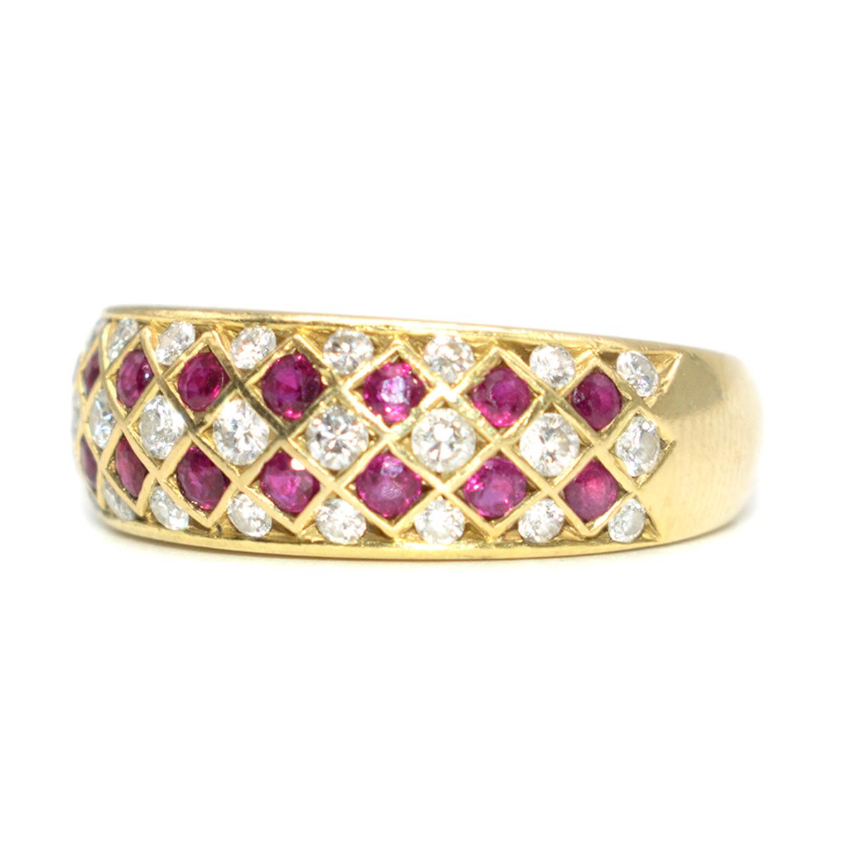 Bespoke Ruby and Diamond 18k Gold Ring

- 18k Gold band - solid weight 
- Ruby and Diamond encrusted eternity design  
- Raised face
- Weight - 7.7g
- Estimated ring size 6. 

Please note, these items are pre-owned and may show some signs of