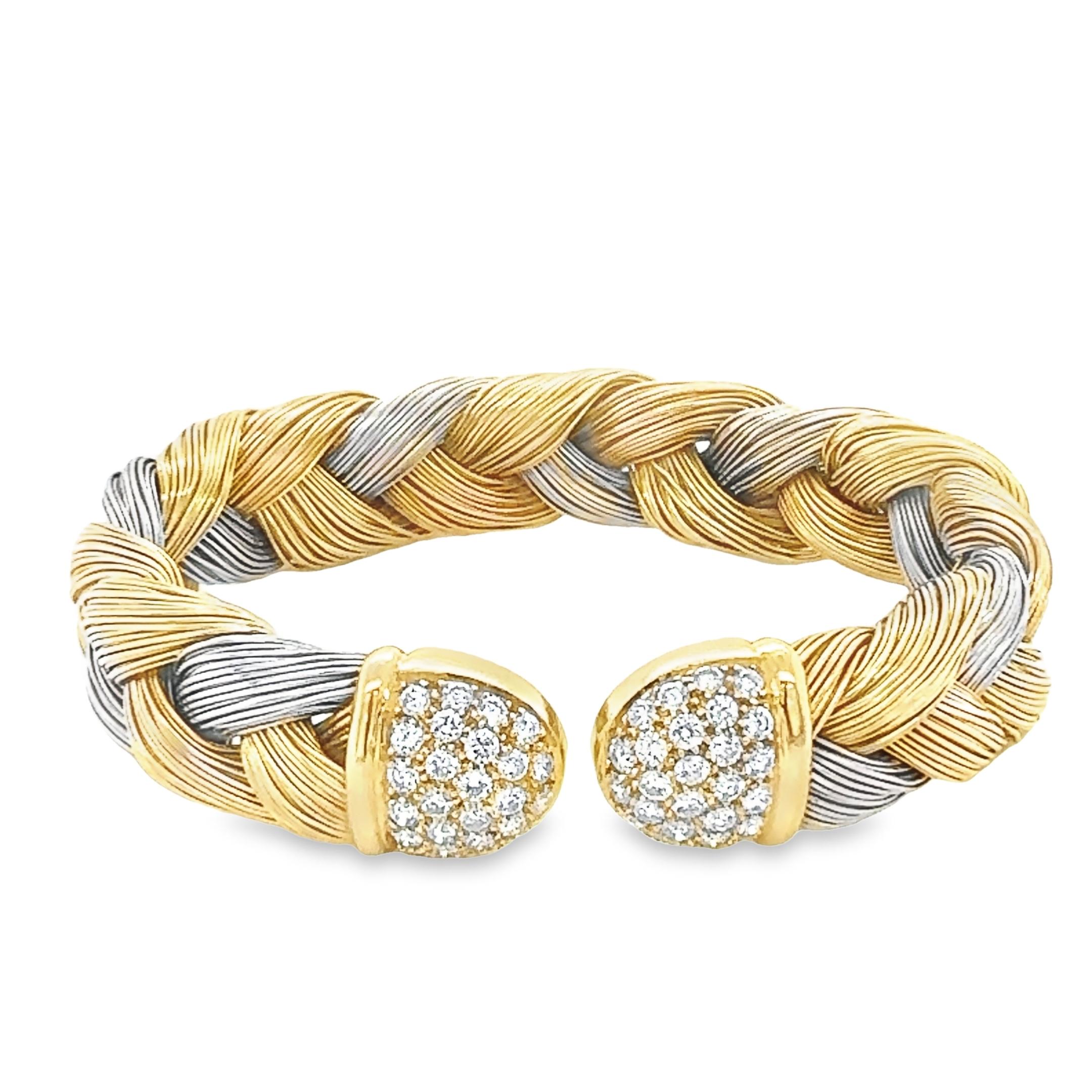 This Bespoke Italian woven cuff bracelet is crafted in two tones of 18 carats yellow and white gold all with high polished finish, embellished with 52 natural round brilliant cut diamonds that seamlessly wrap around the ends of the cuff bangle.
it