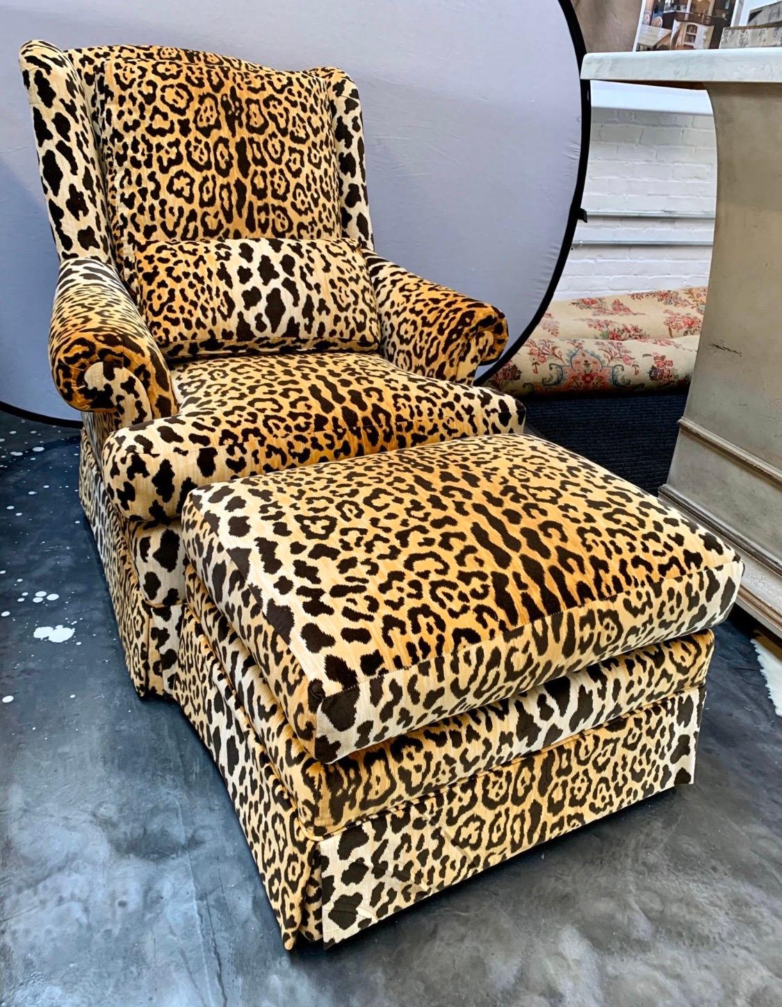 Newly reupholstered in a velvet leopard print, this chair and matching ottoman has 360 degree swivel capability. It not only looks magnificent, it sits great also. The ottoman dimensions are 28