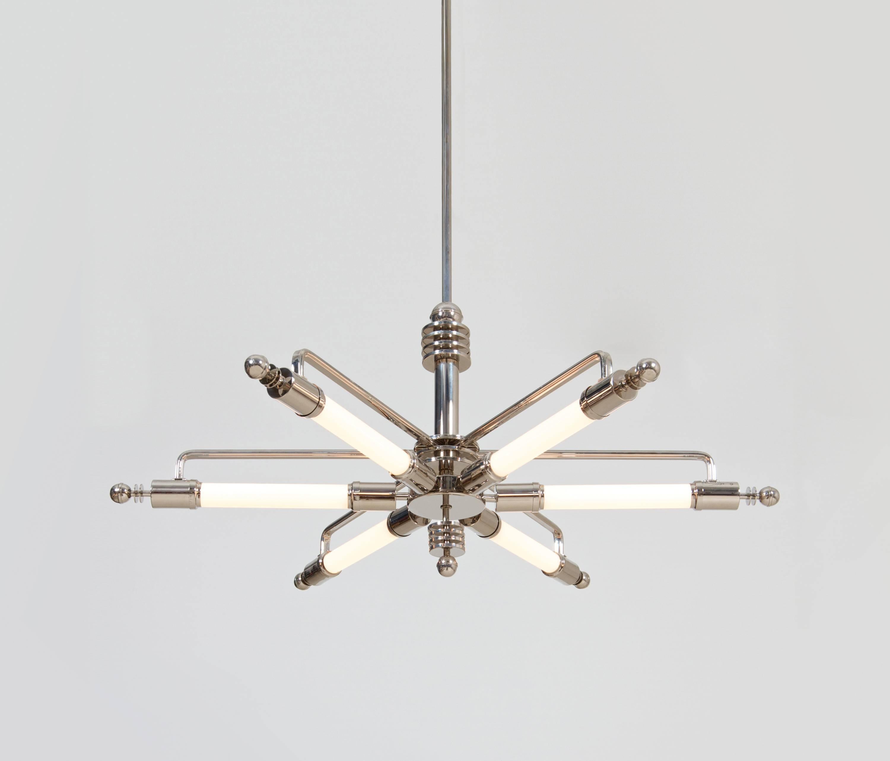 Machine Age pendant light manufactured by GMD Berlin, design 1928.
Technical details: Six sockets E 27, soffitten-lights (tube lights), the pendant length is variable.