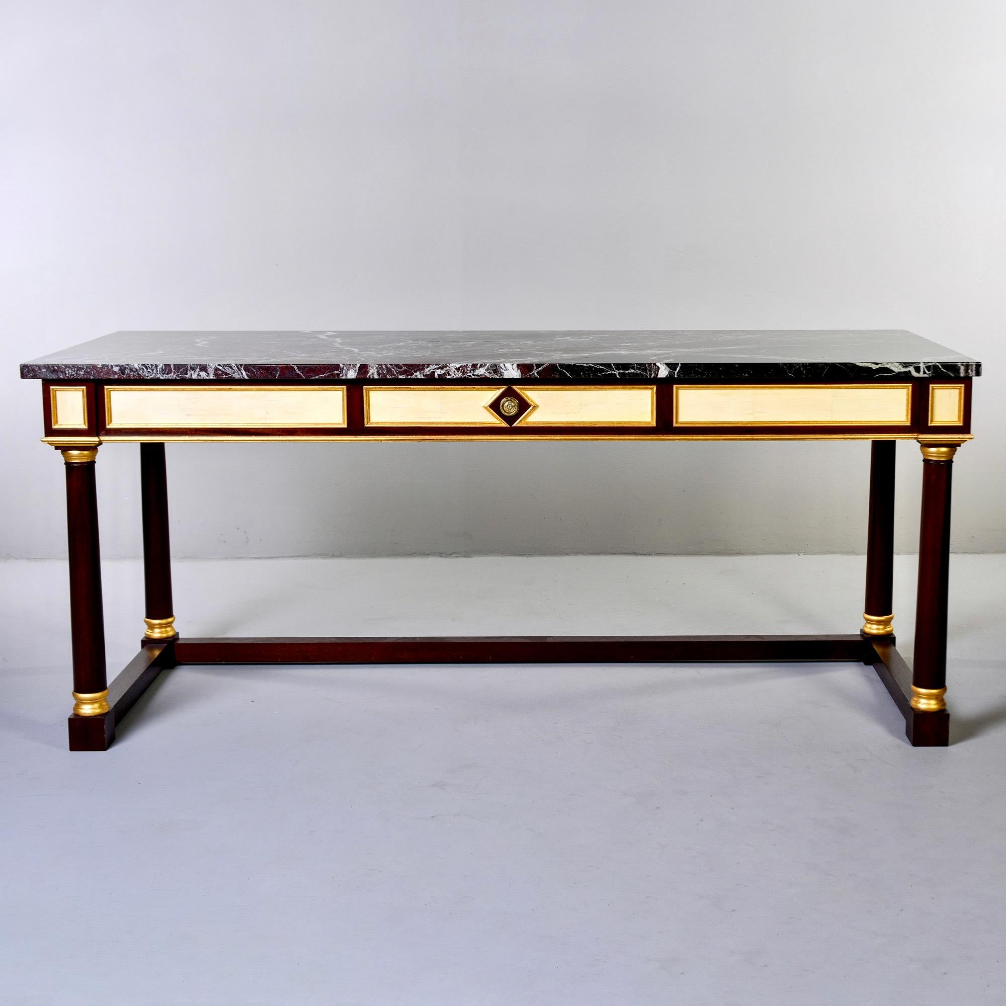 Custom made neoclassical writing desk / console designed by Keith Irvine - decorator for Jackie Onassis, Rex Harrison, Diana Ross and one of founding partners of Clarence House. Desk has mahogany frame with painted and gilded finishes, a dark wine