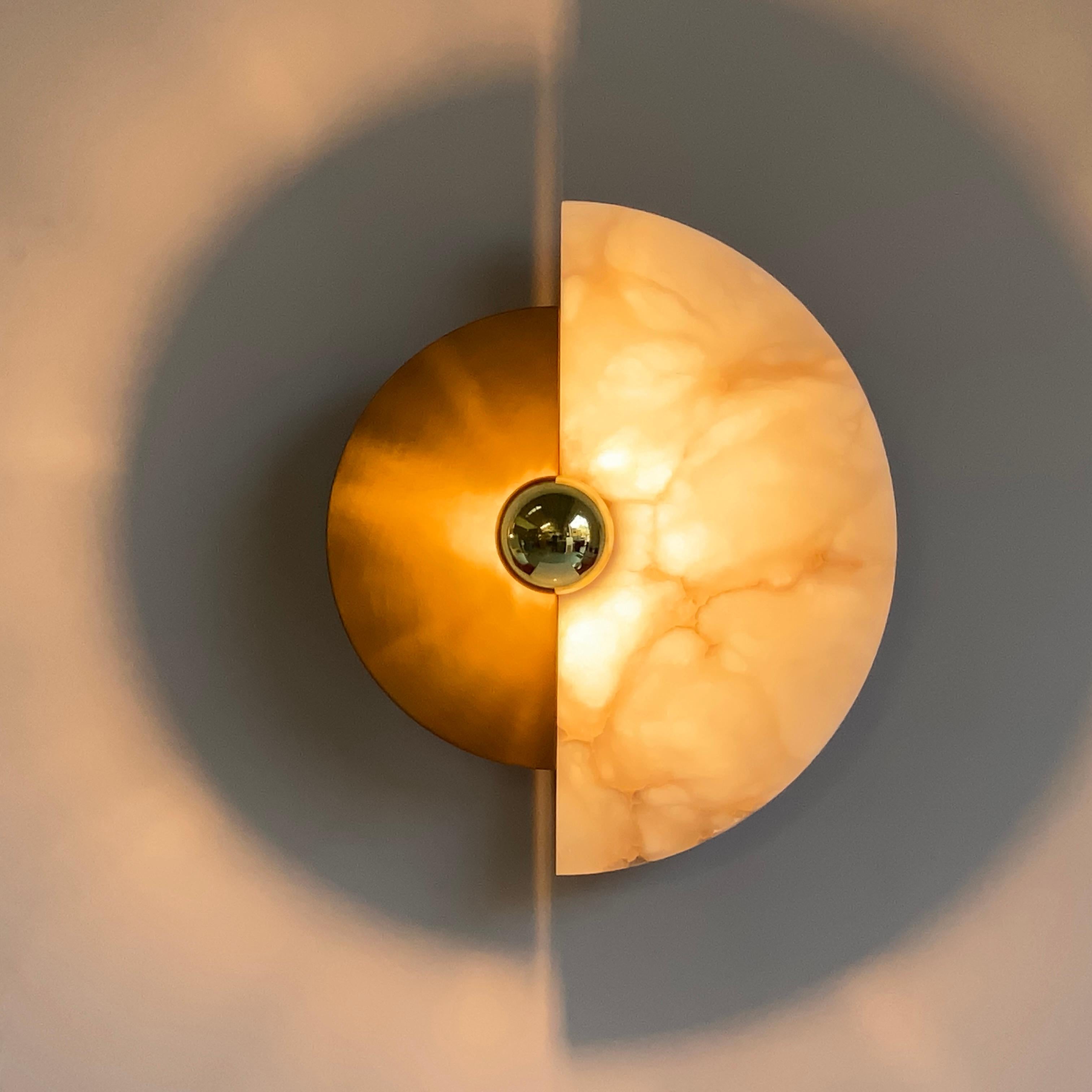 Cosulich Interiors in collaboration with Matlight: this organic wall light, entirely handcrafted in Italy, with its circular shape is called LEVANTE for its strong natural reference to the sun and the moon. The possibility of placing the two movable