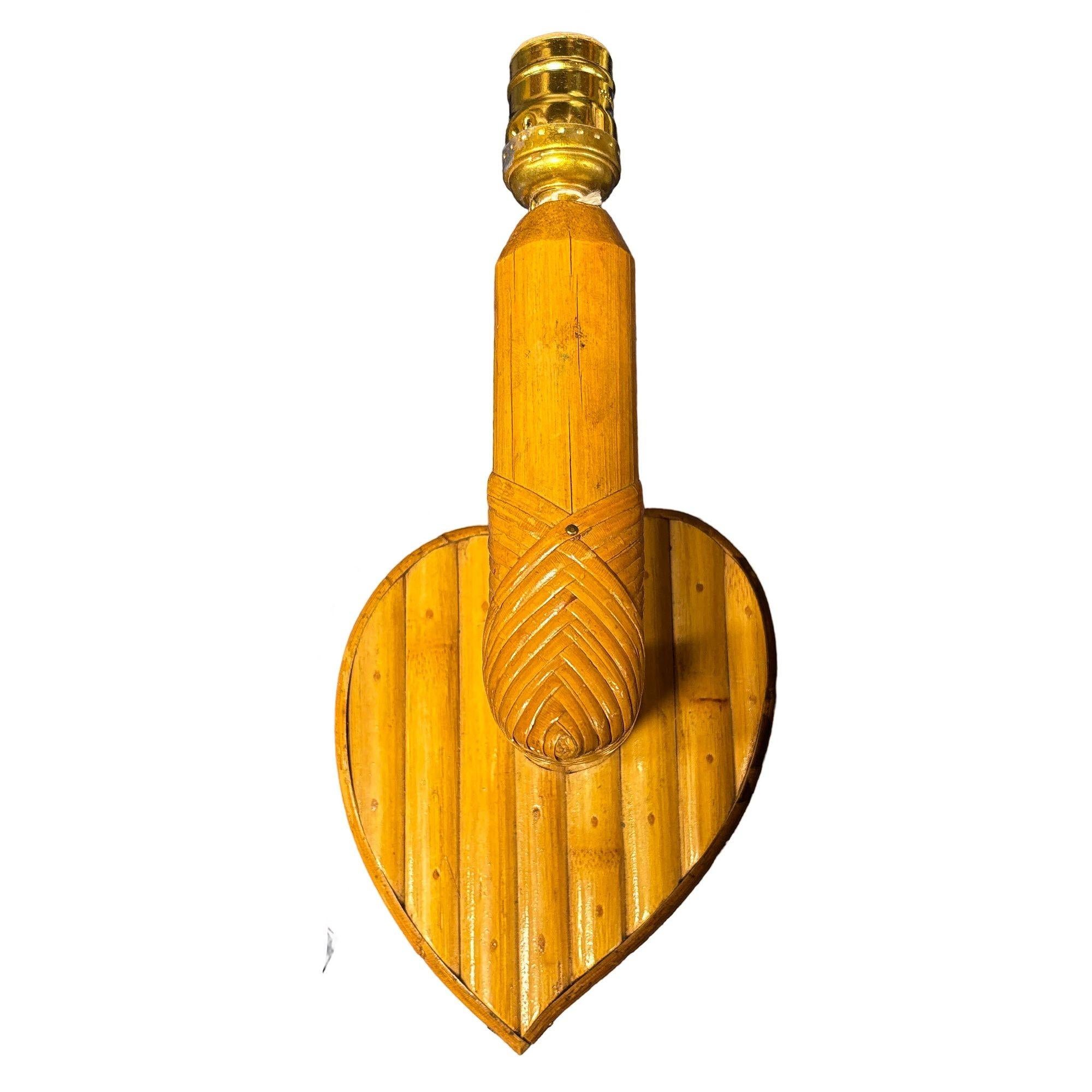 This beautifully restored Custom-made bespoke rattan heart-shaped sconce exudes warmth, blending style and vintage charm with modern comfort. It features a heart-shaped wall made from split rattan mounted to an oak board with a wicker-wrapped rattan