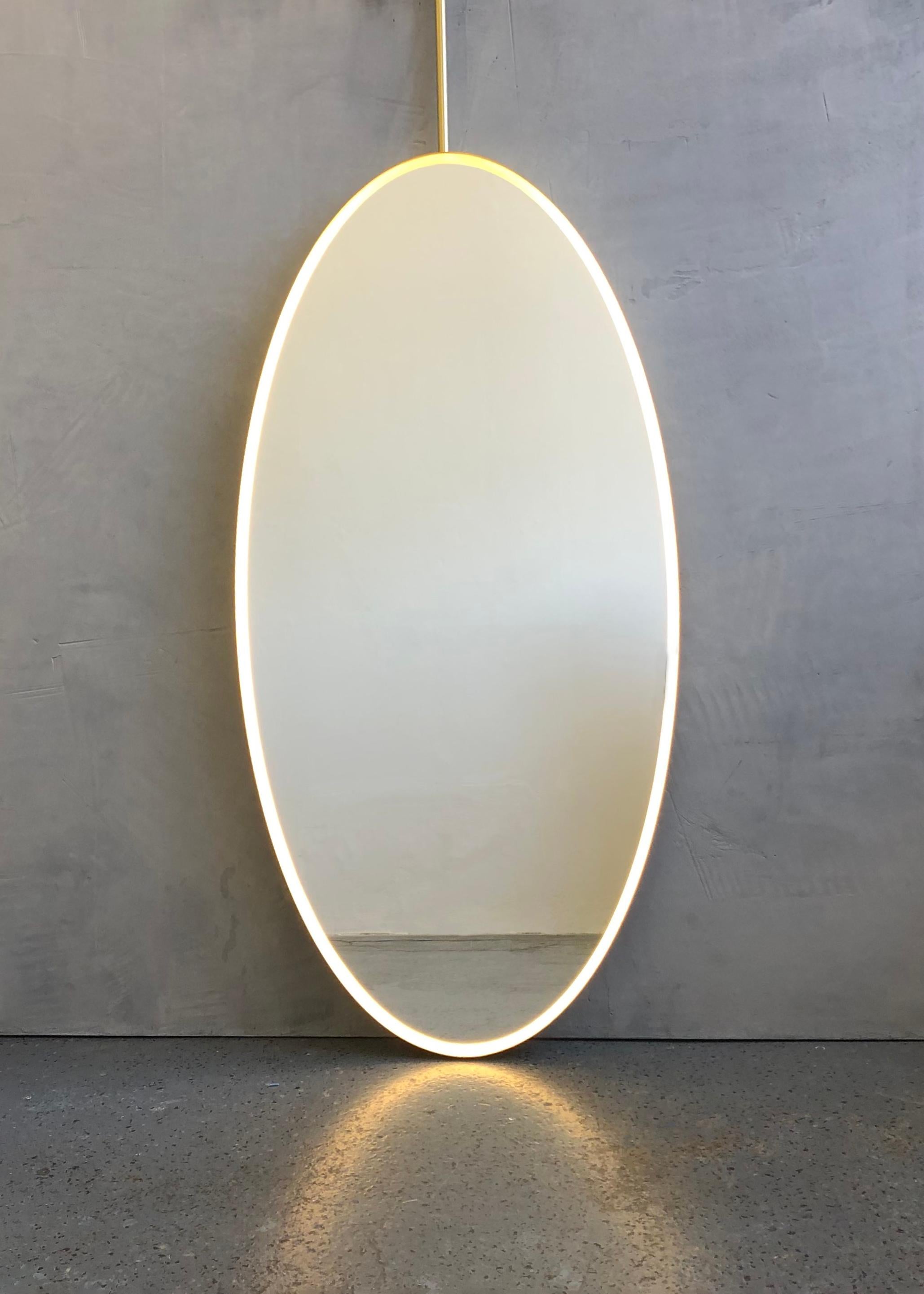 The images in this personal entry illustrate a standard size of the suspended Ovalis™ mirror with a brushed brass frame and one rod. All specifications for this particular entry are as detailed in the presentation already provided and approved.

The