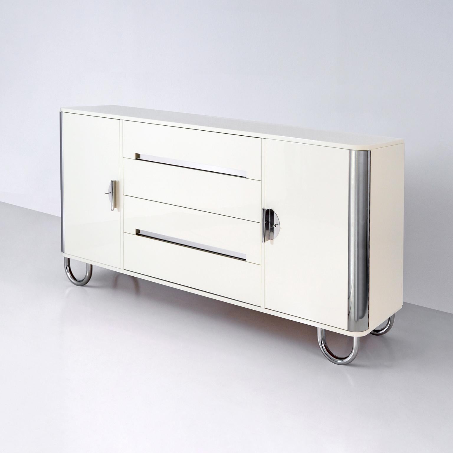 Customized sideboard with two doors and drawers, manufactured by GMD Berlin, exclusively presented in our Rudolf Vichr Collection.

These high-quality, handmade furniture in a classic modern timeless design, are made from selected materials