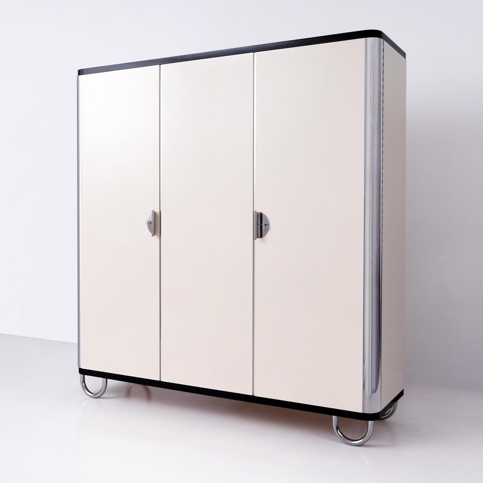 Custom made three-door wardrobe / armoire, designed and manufactured by GMD Berlin, exclusively presented in our Rudolf Vichr Collection.

These high-quality, handmade furniture in a classic, timeless design is made from selected materials