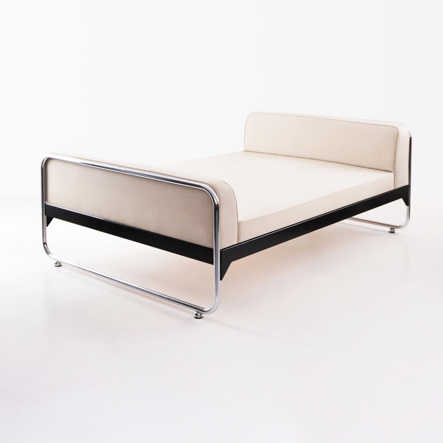 Made-to-measure modernist bed, chromium-plated tubular steel, lacquered metal frame and fabric upholstery. 

Disponible on request in different amounts und dimensions.
Production time: 7-8 weeks.