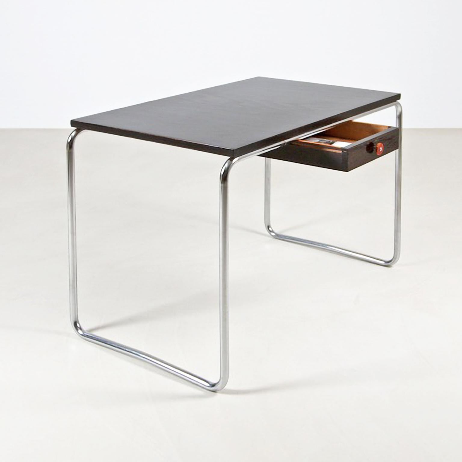 Bespoke modernist tubular writing table made of chrome plated tubular steel and lacquered wood.