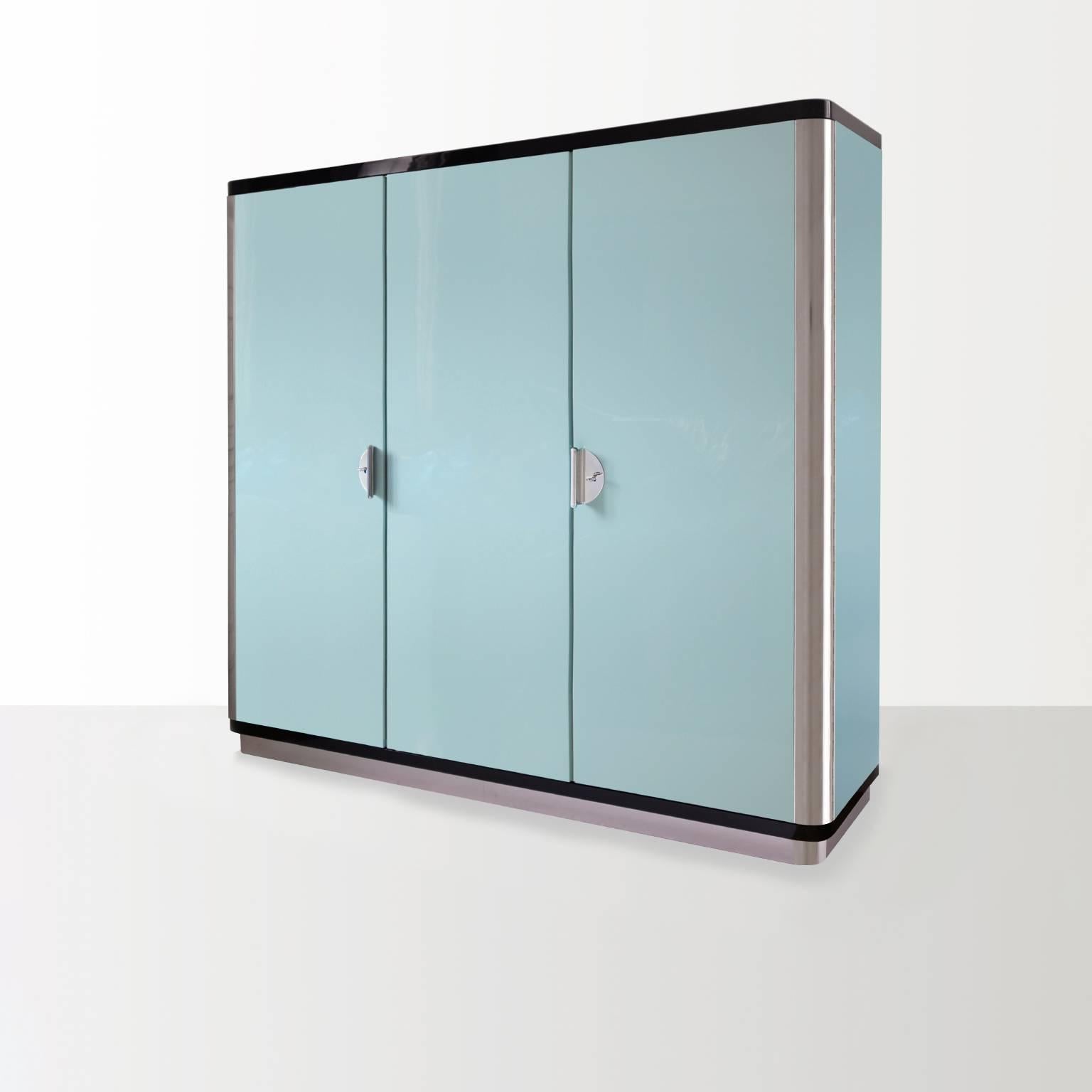 Custom-made three-door wardrobe, manufactured by GMD Berlin, exclusively in our Rudolf Vichr Collection.
High-quality, handcrafted piece of furniture in a classic, modernist design. 
The body is made of high-gloss lacquered blockboard with