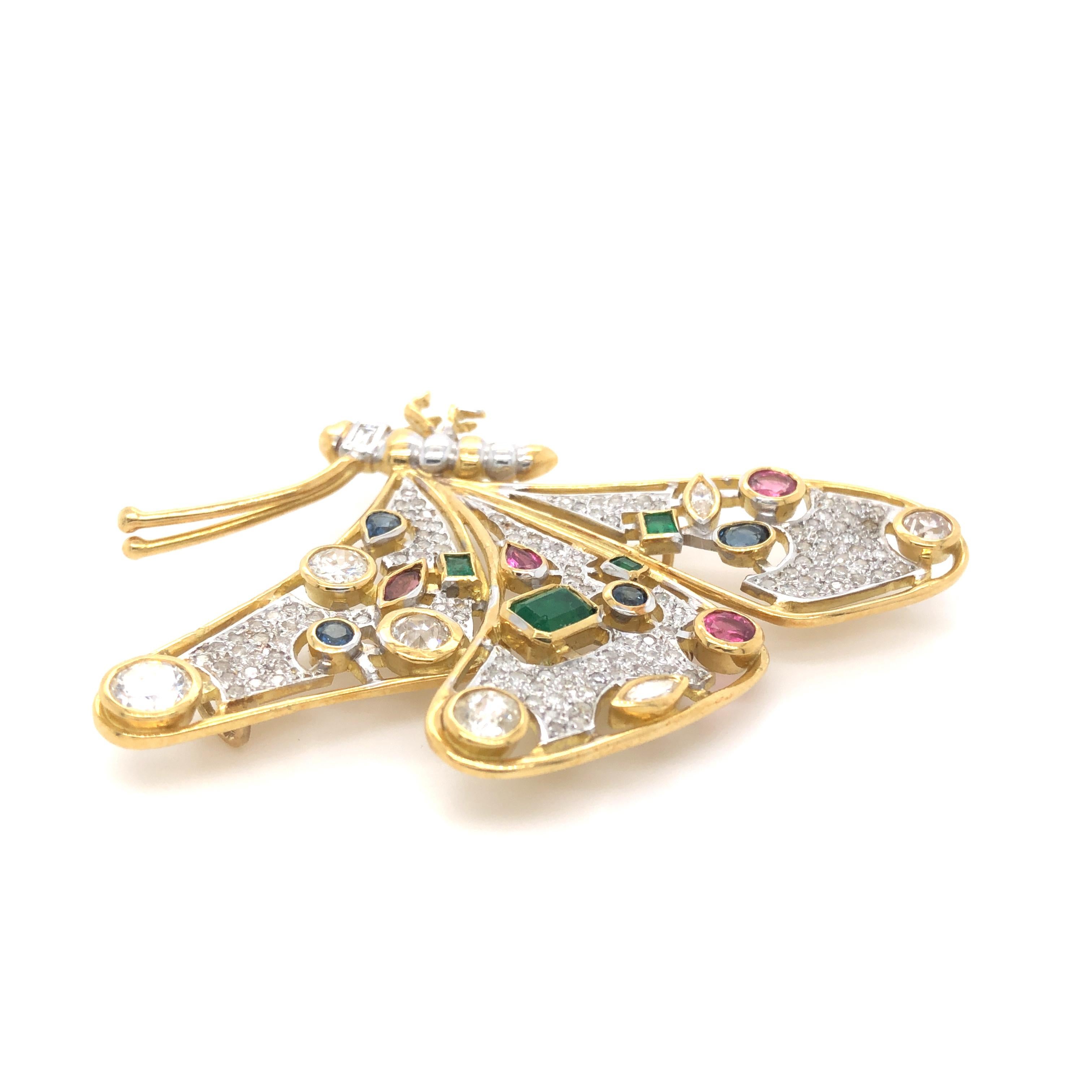 Featuring twenty (20) round brilliant cut, old European cut, marquise, oval,
baguette and pear shaped diamonds, emeralds, sapphires and tourmaline
stones all bezel set in an 18ct yellow gold butterfly brooch, with extra
fittings to make a pendant,