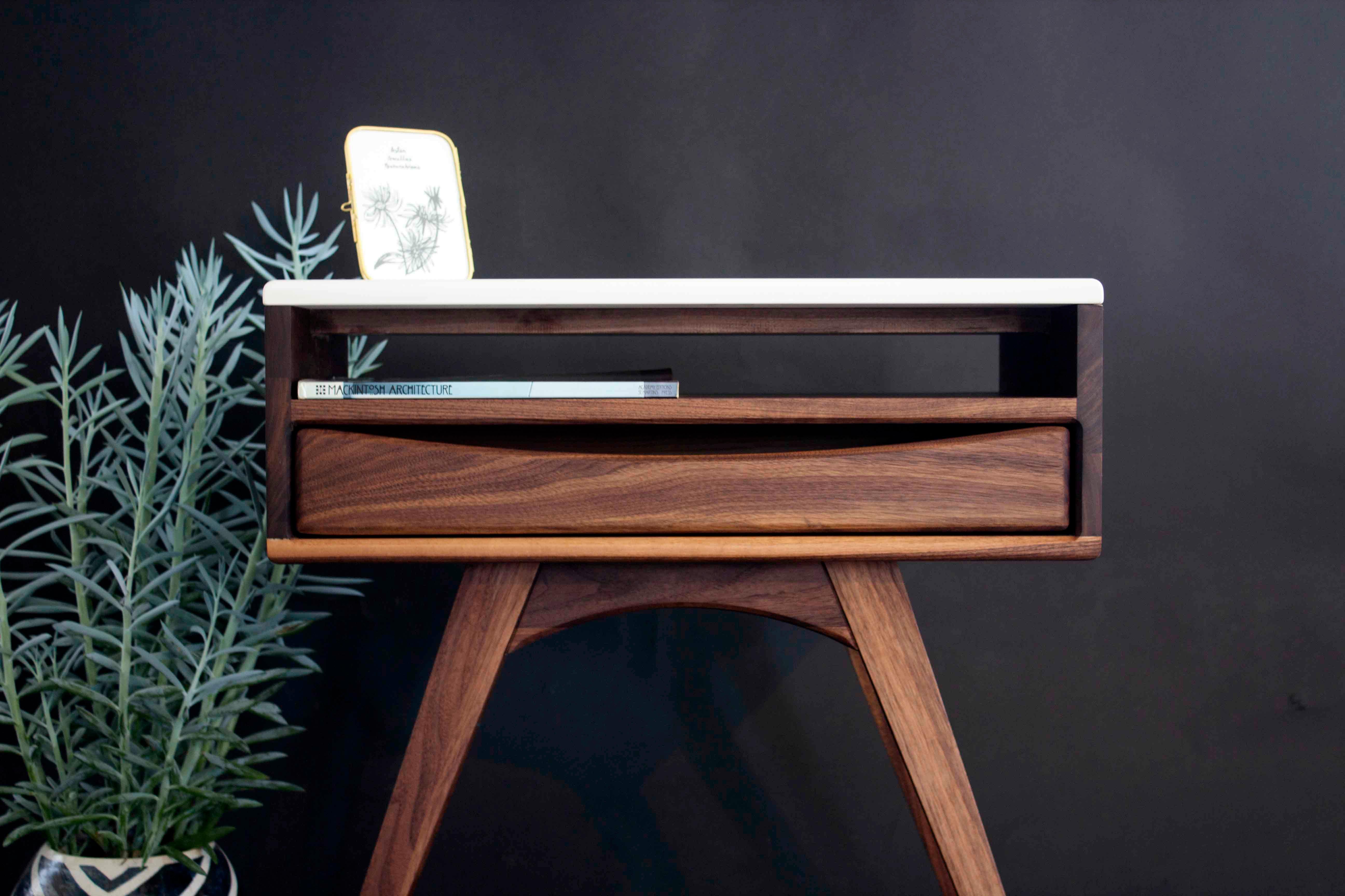 Nightstand Designed and Crafted by Díaz Marentes Studio

This handcrafted bedside table features compass legs, single drawer  featuring a white porcelain top that adds a refined, contemporary touch, drawing inspiration from mid-century furniture
