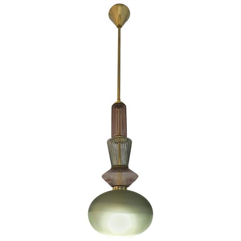Fun and elegant Italian contemporary custom made pendant chandelier, entirely handcrafted, of organic modern design consisting of a succession of elements: handcut jewel like reeded Murano glass components in lilac lavender color and light leaf