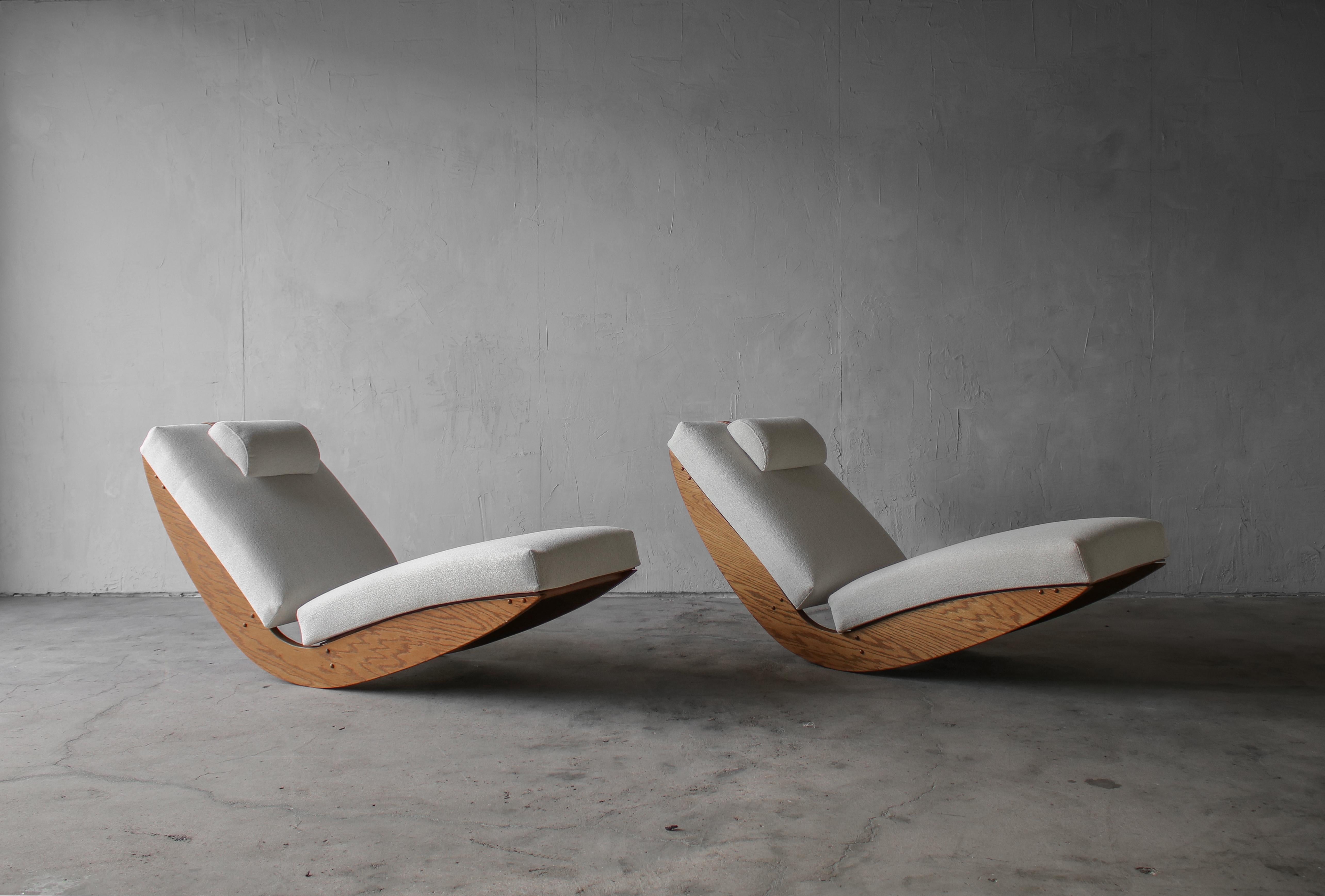 Most likely a custom order or one of a kind pair from the 1970s or 1980s. This great pair of bespoke oak rocking lounge chairs has a very craftsman appeal. If you've been looking for that unique, pair of statement chairs, look no further. These