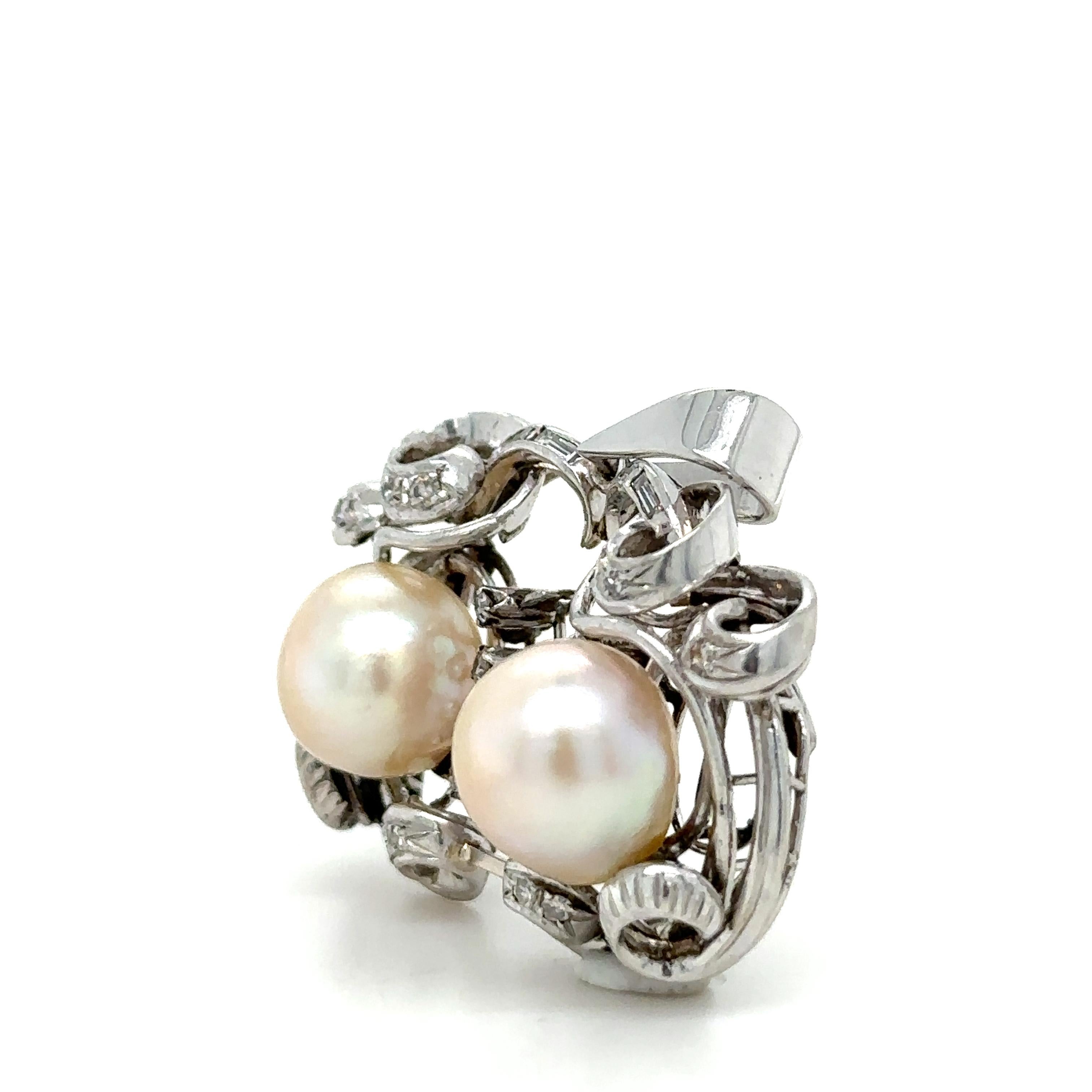 A Pearl And Diamond Brooch, with two 10mm semi-baroque Akoya cultured pearls, 22 single cut diamonds and 4 baguette cut diamonds set in platinum.

Diamonds 26 = 0.45ct (estimated), G/VS to SI

Metal: Platinum 
Carat: 0.45ct 
Colour: G
Clarity: