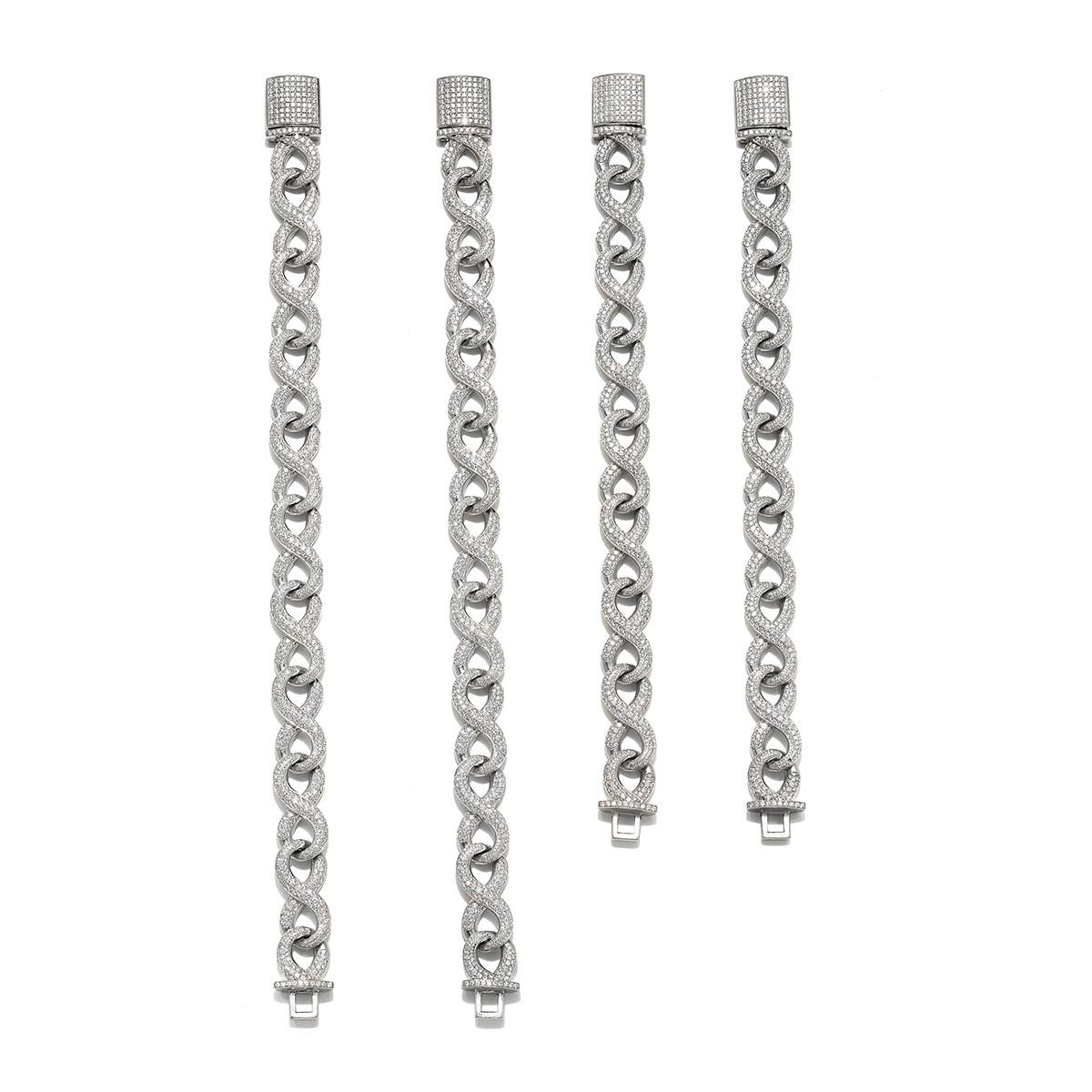 A remarkable, bespoke platinum diamond link suite composed of four individually detachable segments, totaling 782.3 grams of platinum and approximately 80 carats of round brilliant diamonds. Expertly hand-pavé-set with 4,868 stones, this