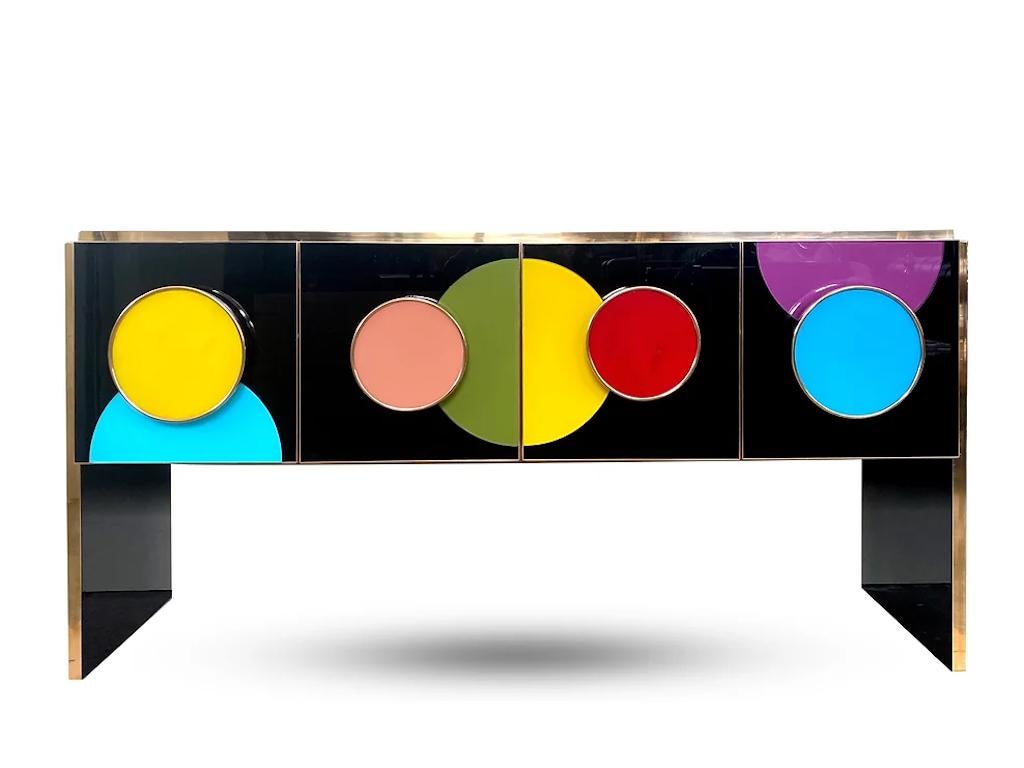 Add fun to your interior and color statement! Contemporary Bespoke customizable 4-door modern console/sideboard, entirely handcrafted in Italy with art glass hand painted on the reverse, with a Minimalist Art Deco Design shape. This piece, raised on