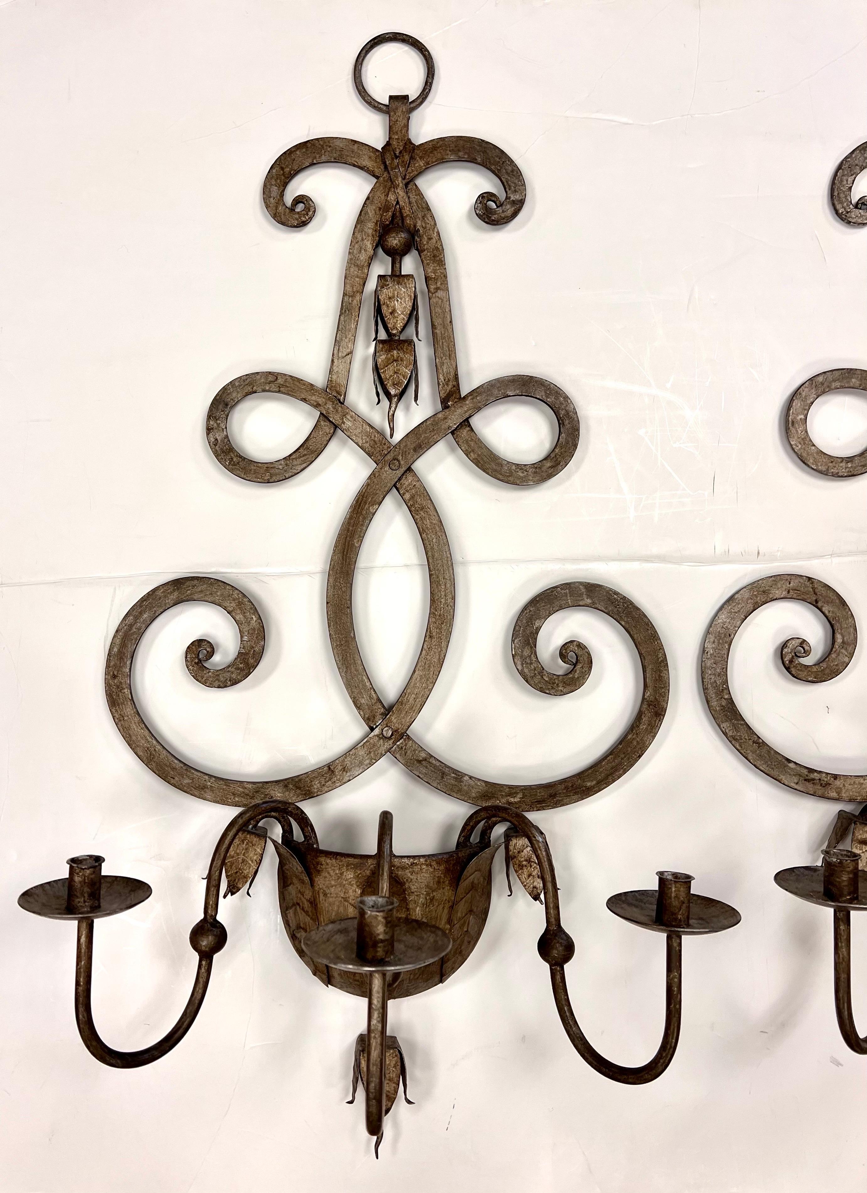 Bespoke, large pair of Florentine Rococo style metal candle sconces for wall decoration. Features intentional rustic patina and larger scale, see dimensions.
Unsigned. Gorgeous.