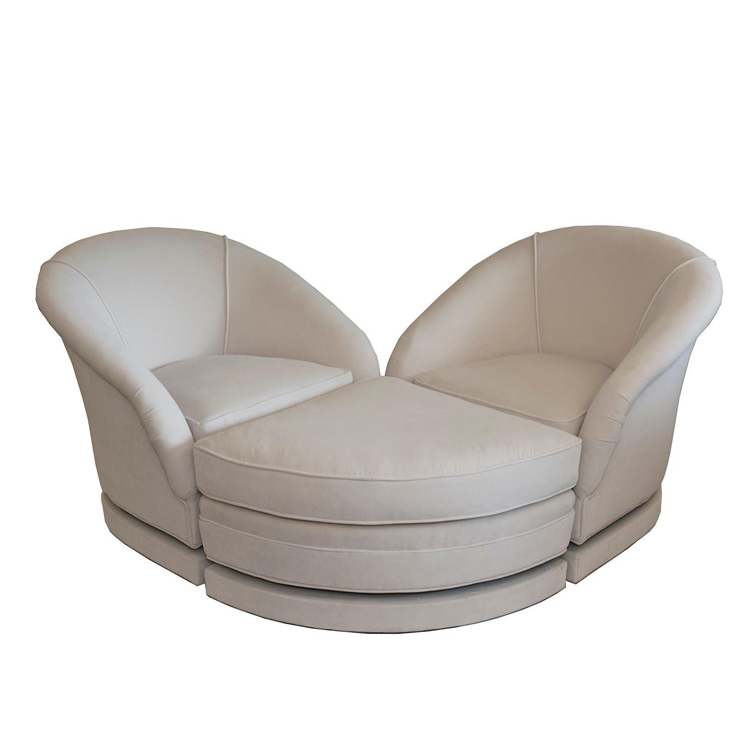This unique set of two swivel chairs and ottoman was restored and reupholstered in our Connecticut studio, a most unusual design, both feminine and functional done in a luxurious ivory velvet, The curvilineal design enables a most comfortable