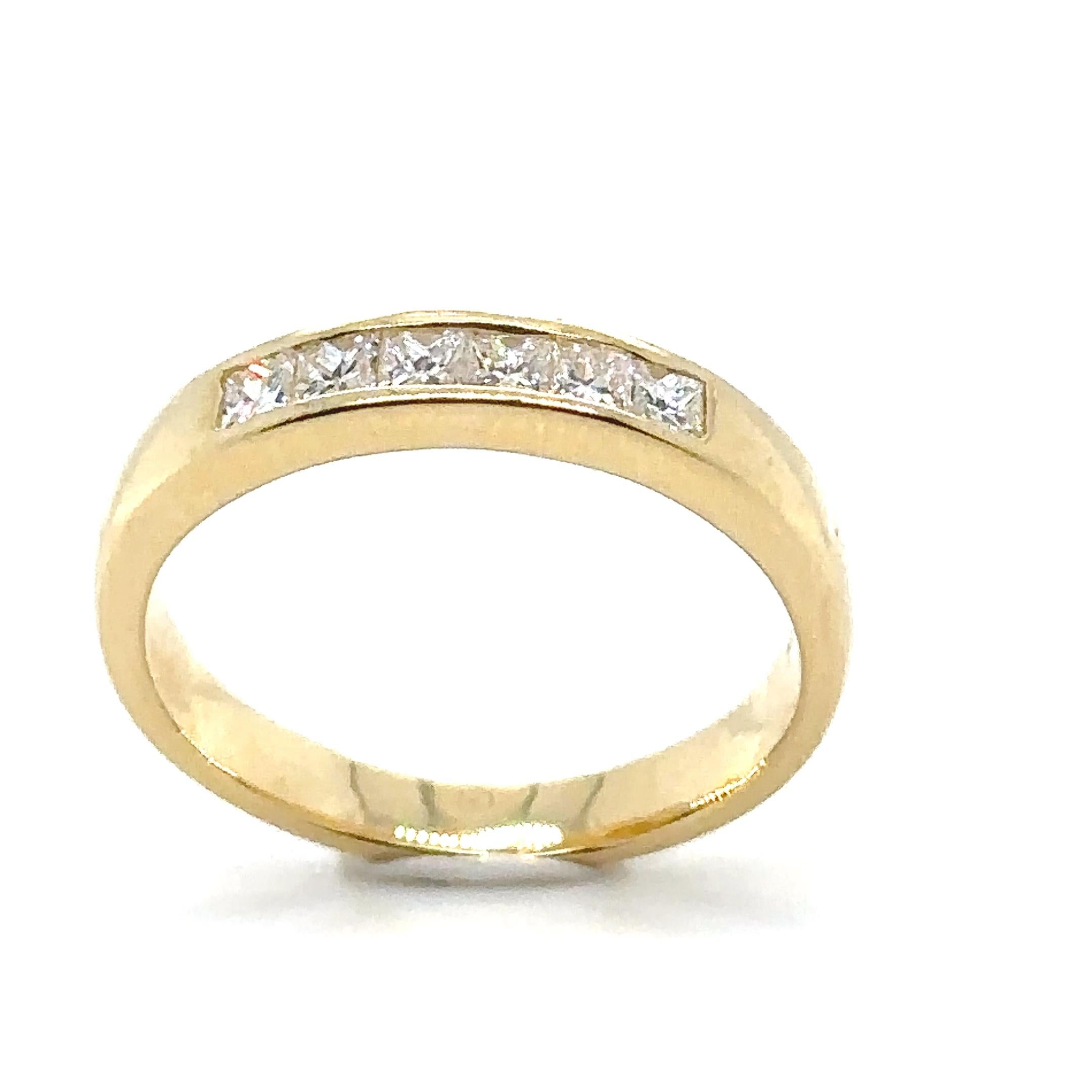 A Six Stone Princess Cut Diamond Ring, channel set on 18ct yellow gold on a 3.5 to 2.7mm tapered band.

Diamonds 6 = 0.40ct (estimated),

Graded in setting as Colour: F, Clarity: VS. Weight 3.93 grams.

Metal: 18ct Yellow Gold
Carat: 0.40ct
Colour: