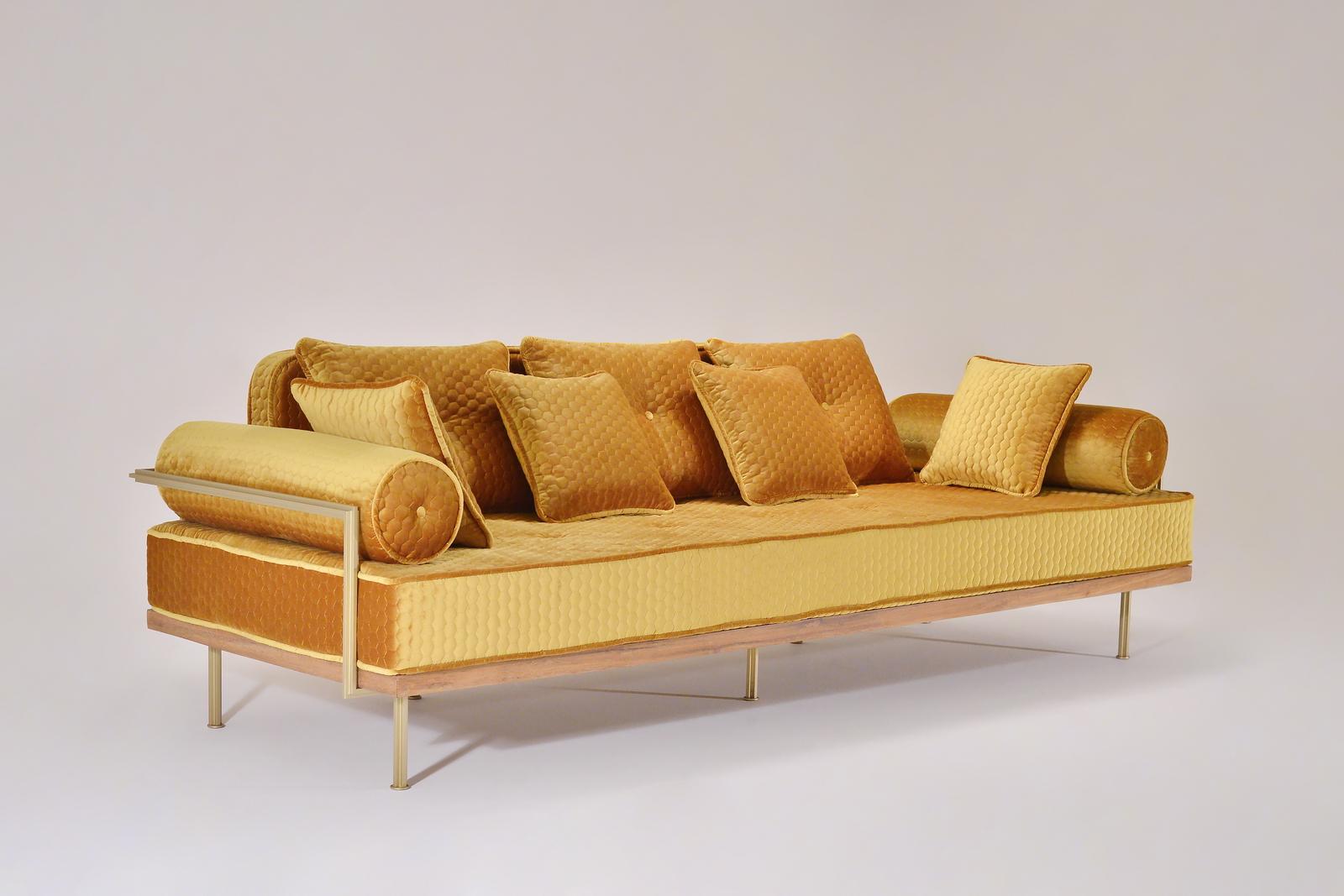 We created this gold three-seater sofa to on in our, 