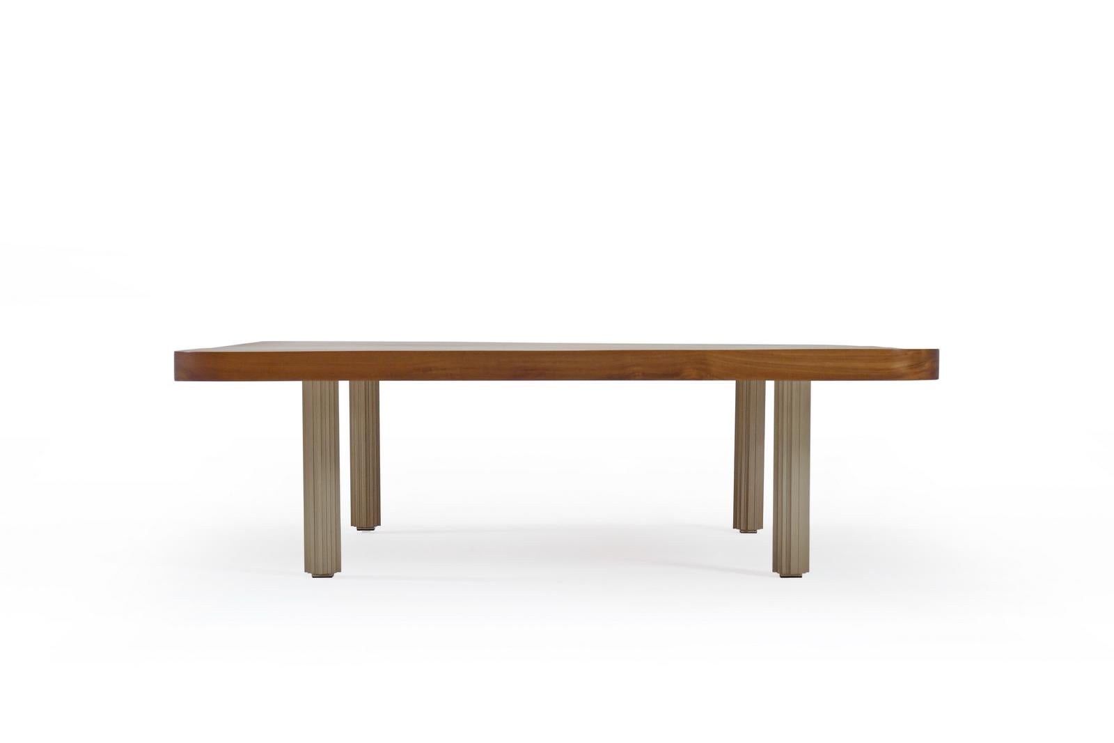 We created this low table as a center piece for a client’s outdoor lounging area where . The corners have been rounded to improve not only the aesthetic but also soften the edge. The 4.5cm thick reclaimed Teak wood is on our newly developed brass