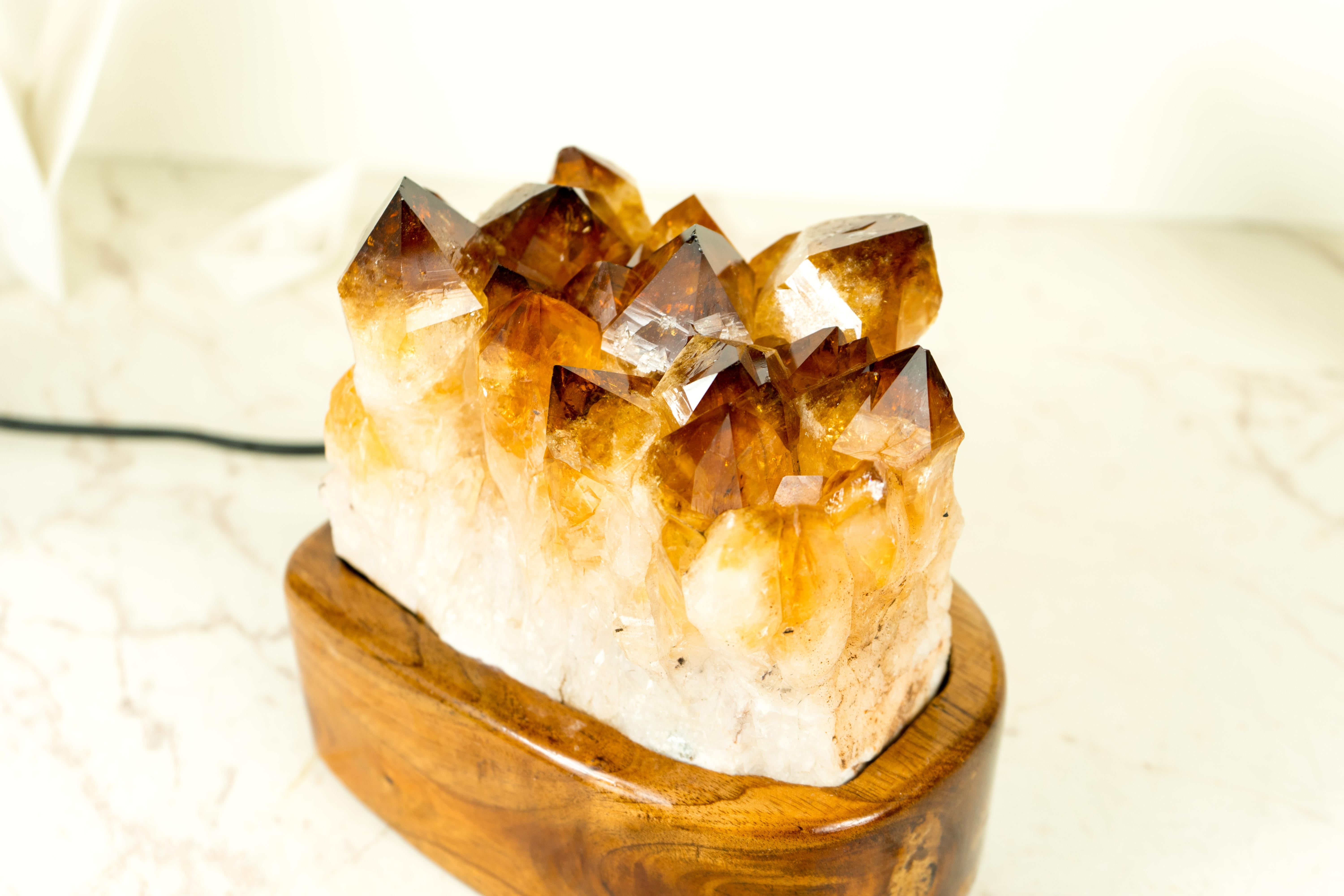 Designed by E2D Crystals, this Citrine Geode Cluster table lamp is a one-of-a-kind item, created with a focus on uniqueness, quality, and beauty. We used only the best materials, bespoke craftsmanship, and the most unique Citrine we could find to