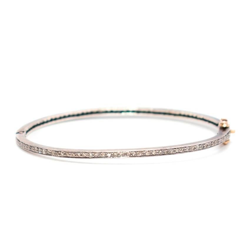 Bespoke white gold plated thin bracelet filled with small diamonds and with a yellow gold detailed closure.

Fabrics: White Gold and Diamonds.

Condition: 9.5/10.
In very good condition.

Approx:
Circumference- 19cm