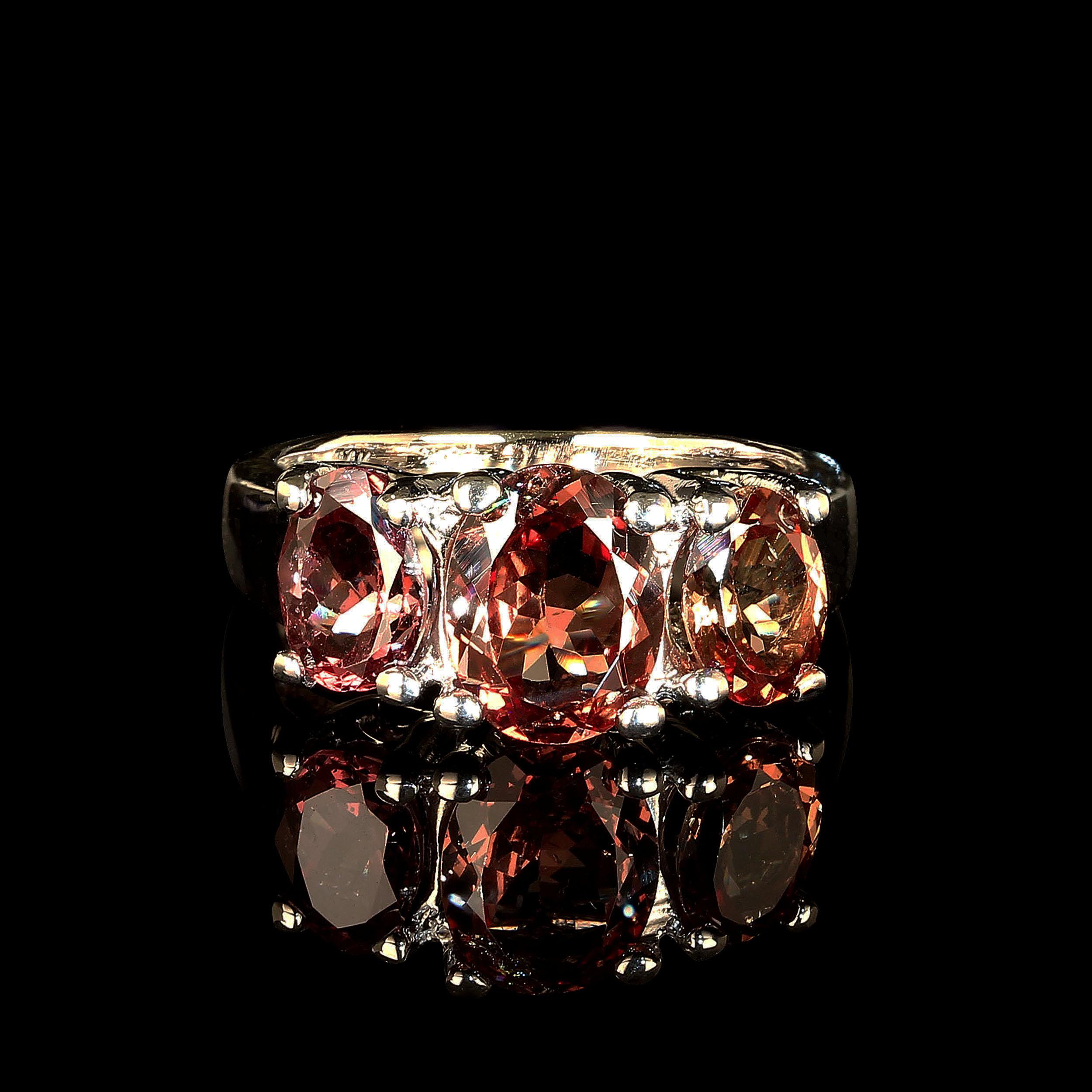 Great January Birthday gift!
14K White Gold Setting cuddles these three lovely color shift Garnets.  They make a subtle shift from pinky brown to goldy brown with a light change. These 3.96 total carats are just the thing for all you Garnet lovers.